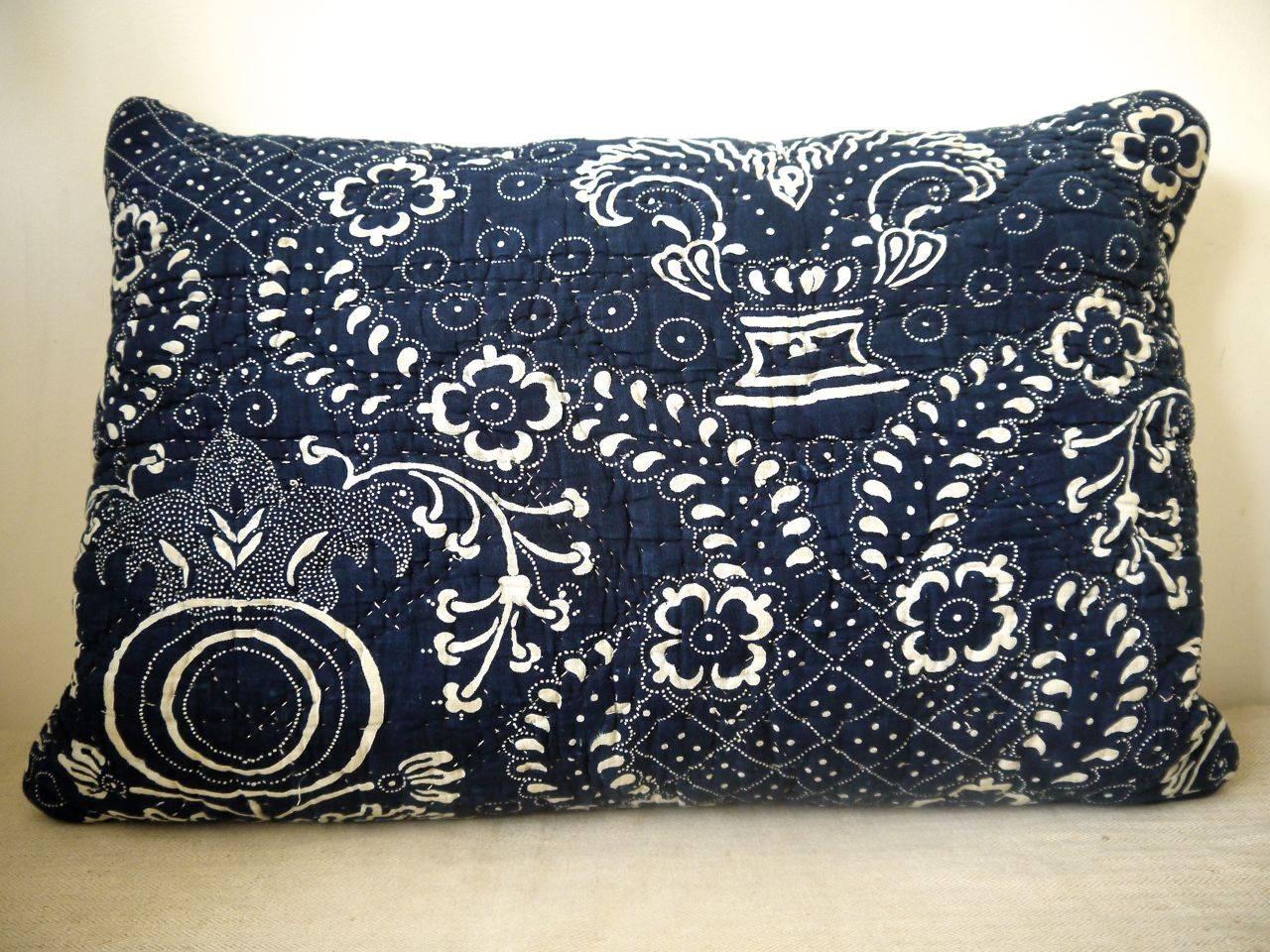 French Toile de Nimes indigo resist block printed lumbar cushion. Striking design of stylized pomegranate and floral motifs. Simply quilted and block printed on a soft cotton and backed with dyed 19th century linen. Slip stitched closed with a duck