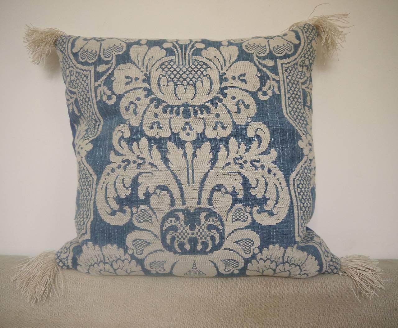 French, circa 1760s woven linen and cotton cushion. Wonderful texture and contrast of weaves and yarns. Antique French linen fringes at each corner and backed in a dyed French 19th century linen. Slipstitched closed with duck feather insert.