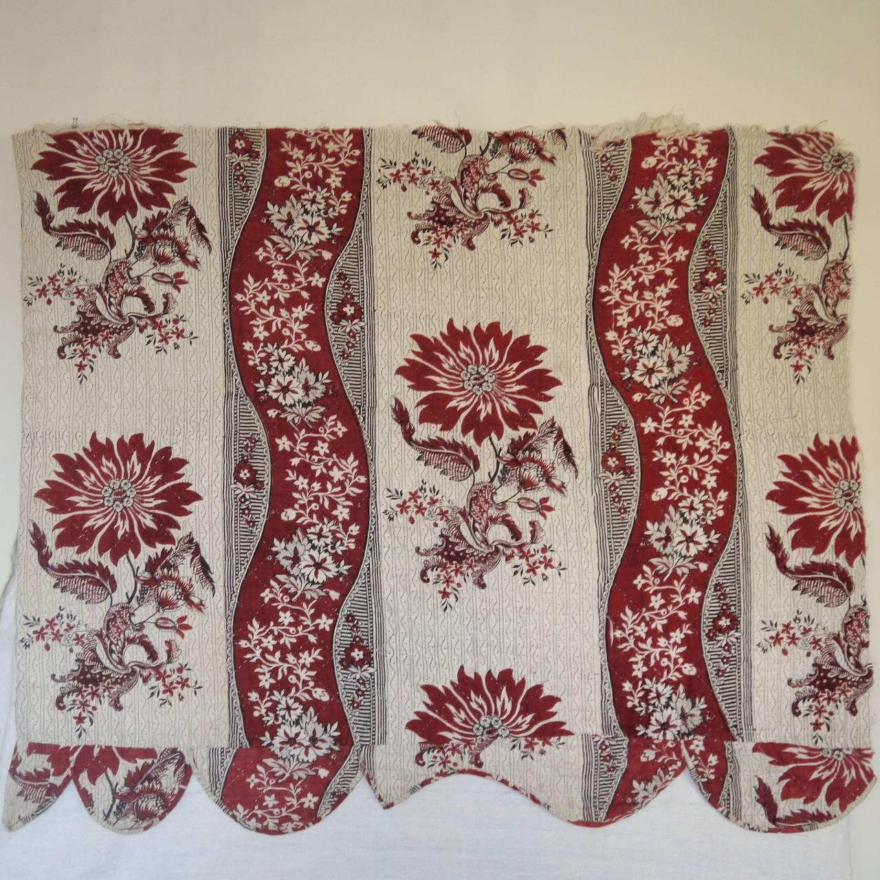 French circa 1790s block printed cotton small panel with a large-scale stylized floral design. Originally part of a bed hanging and from Nantes or perhaps Beautiran. Fantastic crimson color and in very good condition. Backed in a heavy linen and
