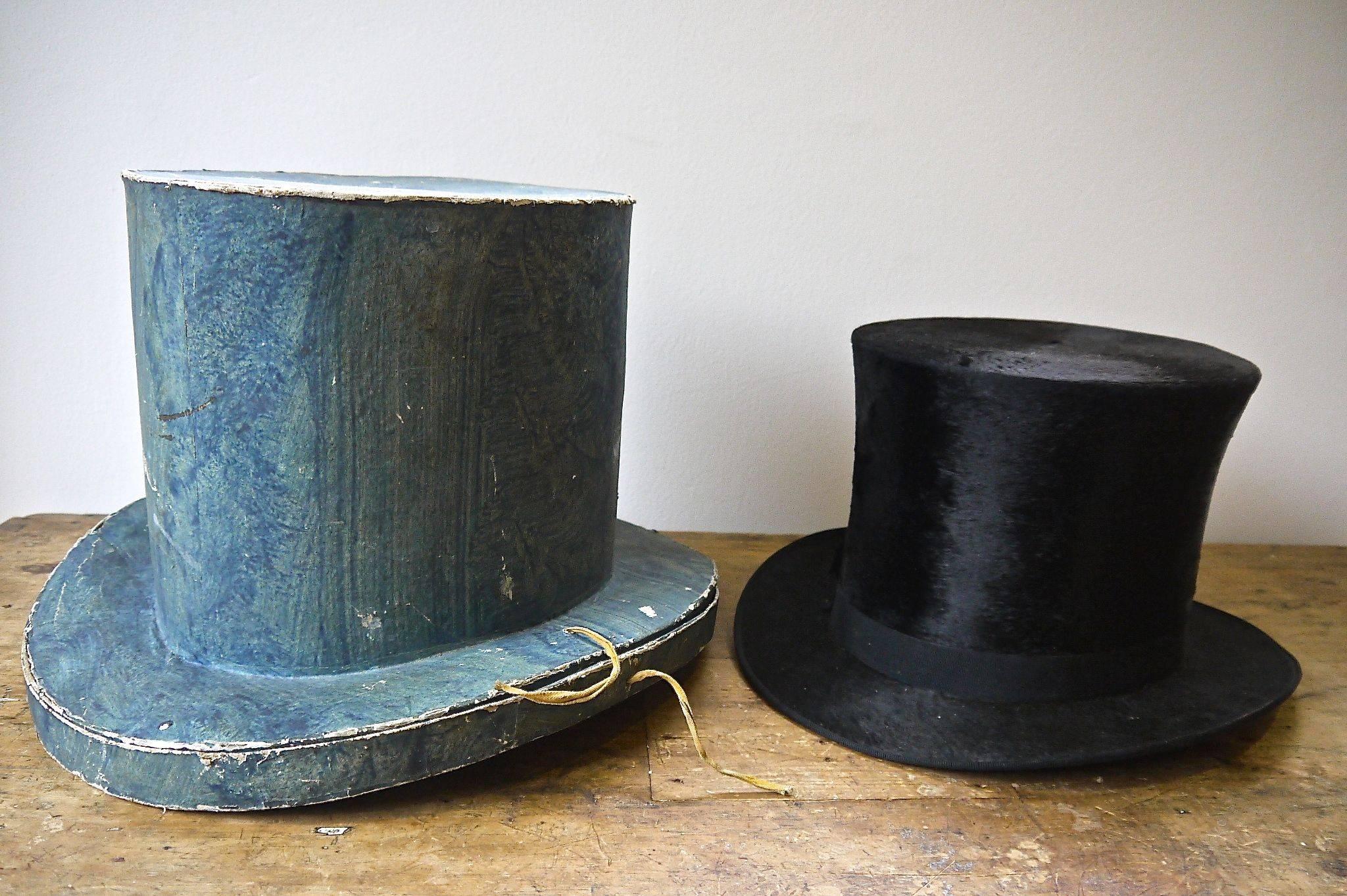 Late 19th century Swedish papier mâché top hat box in a beautiful shade of blue with the black top hat inside. Label in the hat reads A. Ericsson & Comp Stockholm.
 