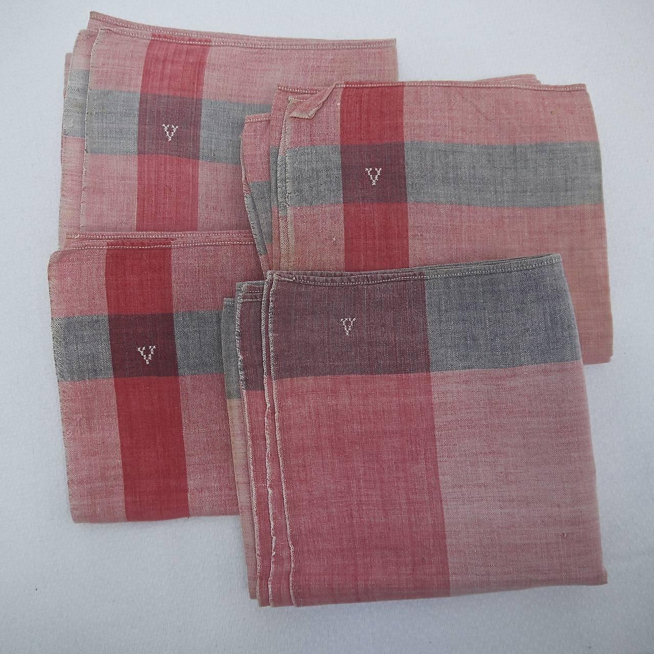 Set of four French faded indigo and red cotton mouchoirs with a letter V monogram on each corner .One is of a different design.