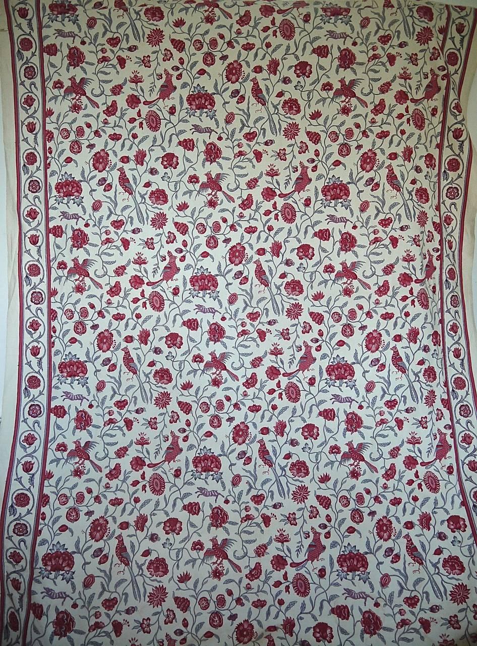 Early 20th century French printed linen panel in raspberry pinks and reds and pale grey. Stylised meandering branches and flowers with exotic birds and animals.