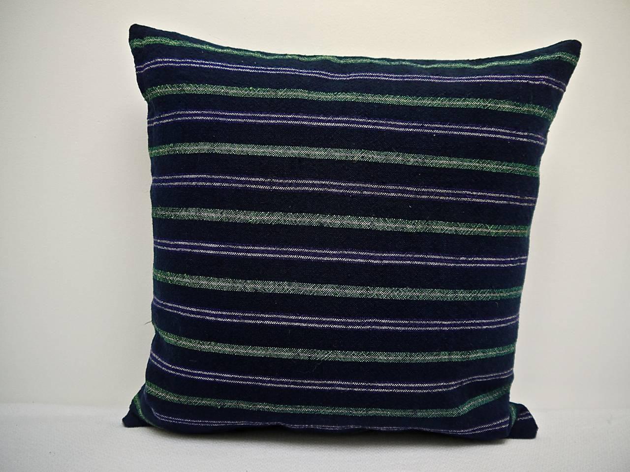 French 19th century woven cotton and wool striped square cushion. Dark indigo with white, green and purple colors in a pleasing combination. Backed in a natural indigo hand-dyed 19th century French linen. Slip-stitched closed with a duck feather