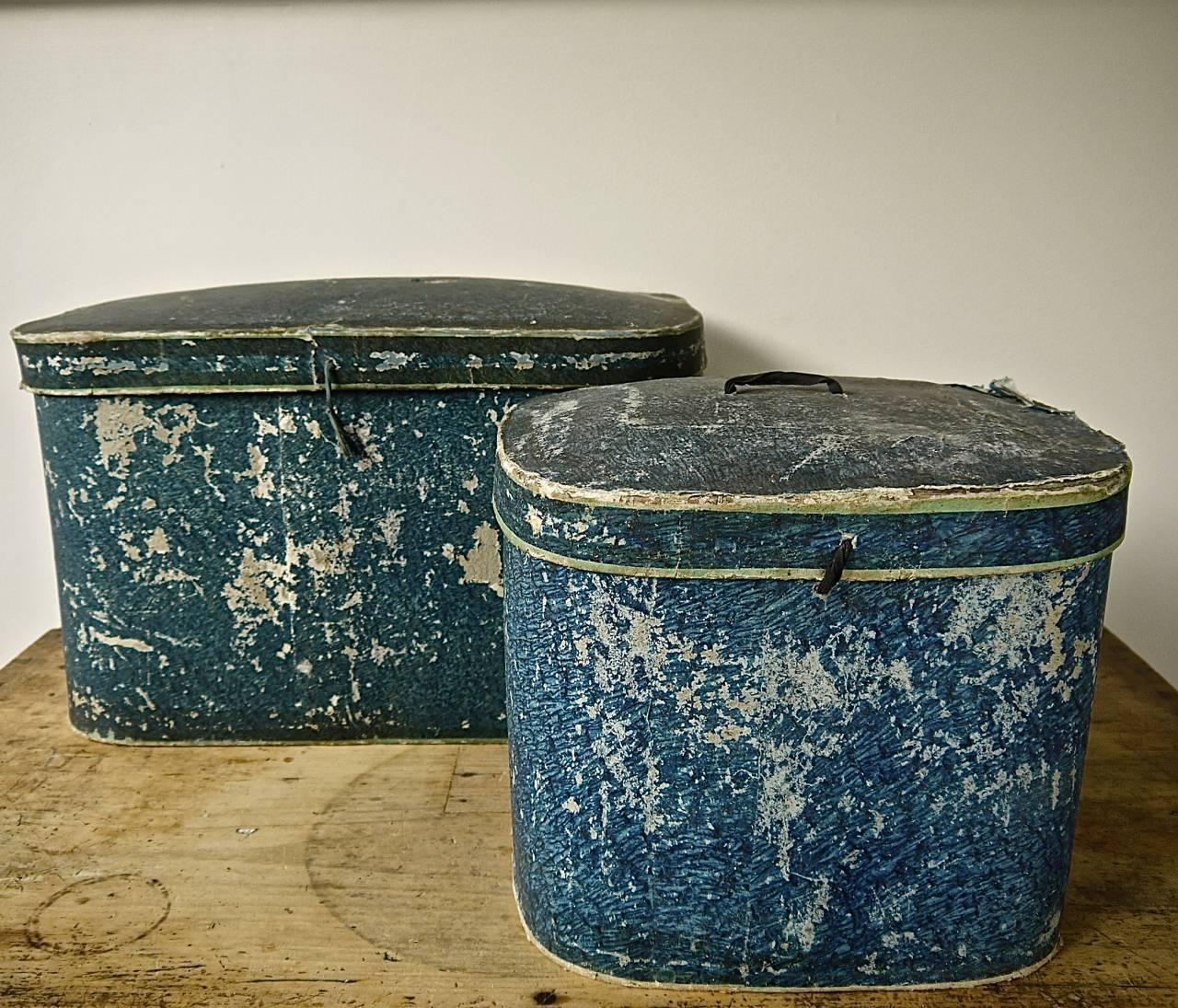 Pair of French late 19th century papier mâché hat boxes in a beautiful shade of blue. Larger size has an interesting and unusual domed lid and oval shape. Both have their makers label 'Noel'.
Large box measures 49cm long x 29cm wide x 31cm