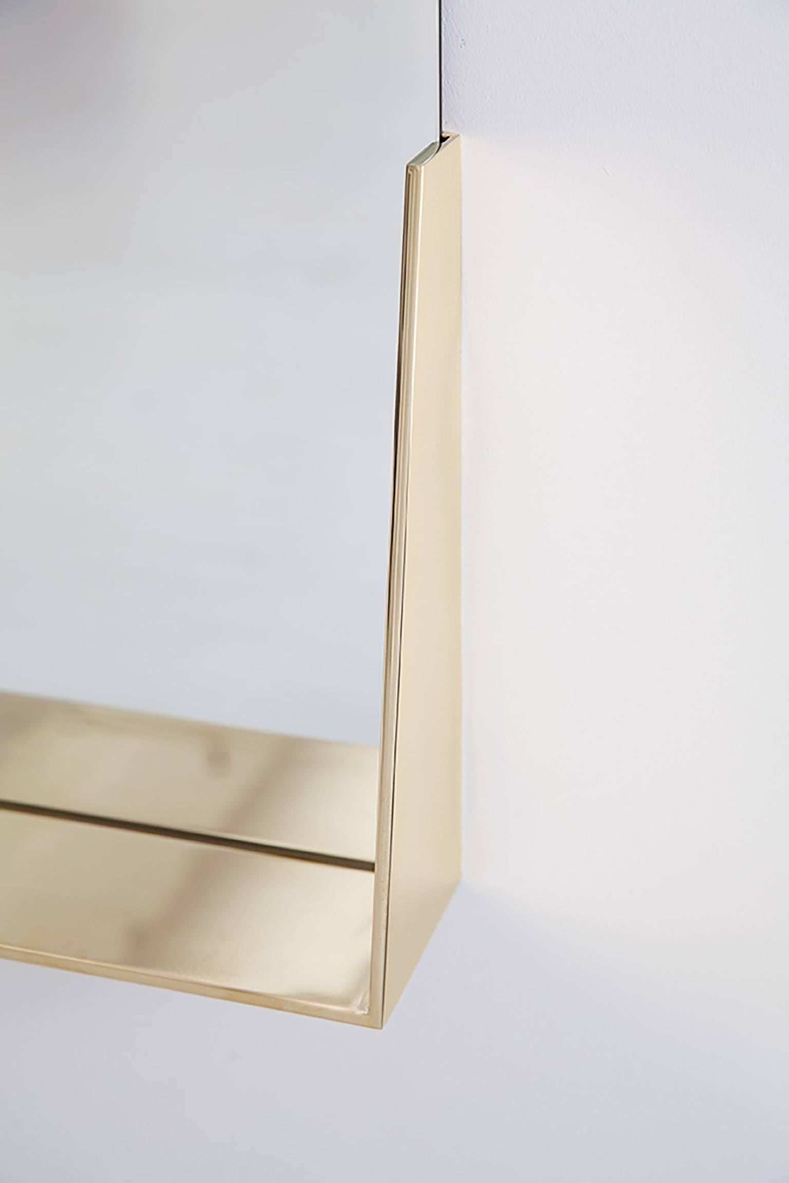 The Feehan Mirror is crafted in collaboration with our team of highly skilled local fabricators, and is constructed of mirrored glass and brass.