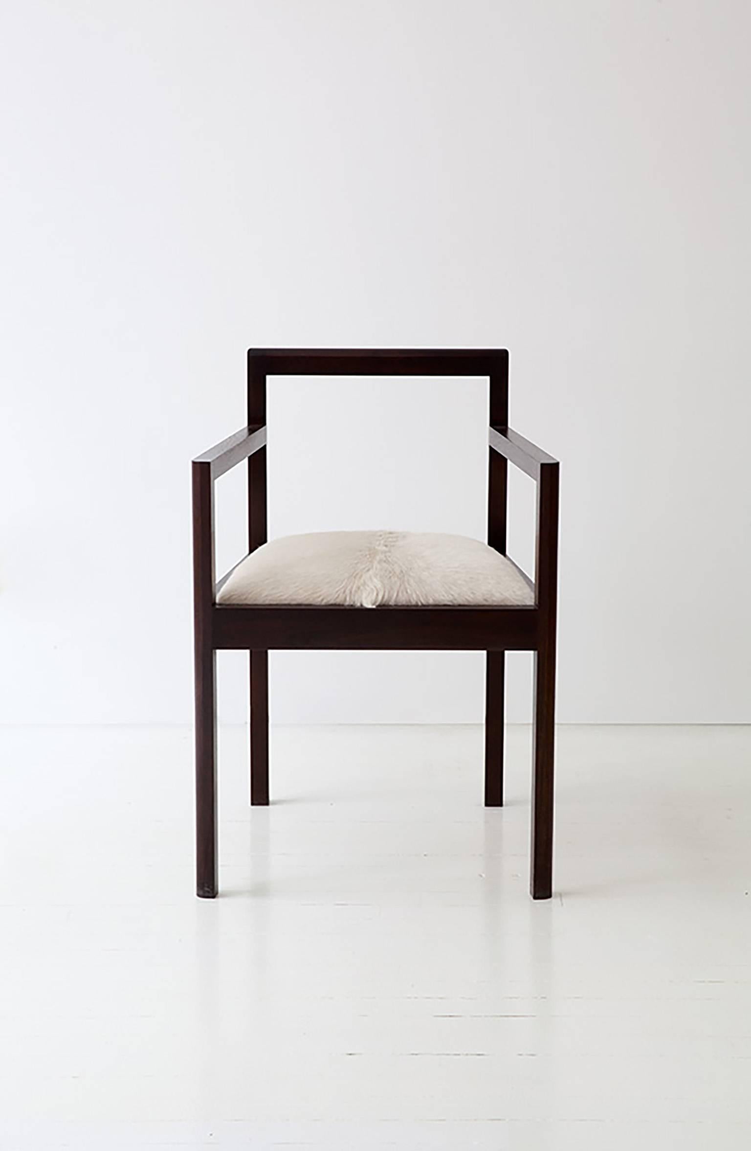 The Densen Arm Chair is handcrafted in our Brooklyn studio and in collaboration with our team of highly skilled local fabricators. It is constructed of solid wood and upholstered in COM. Shown above in walnut. 