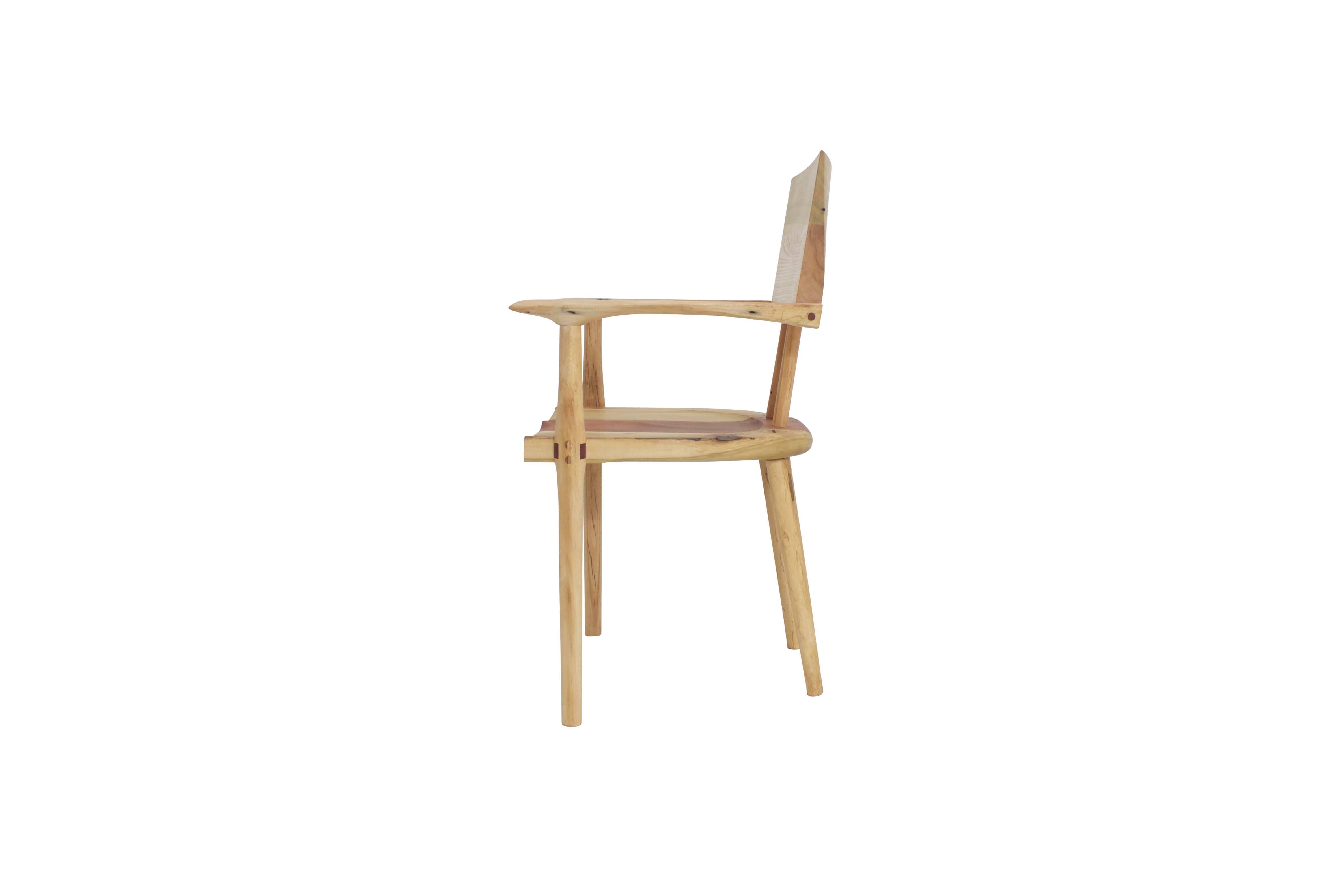The Chubby chair evokes a feeling of solidity, weight and forward movement. Ergonomically-friendly features including hand-scooped seat grooves, hand shaped arms and back rest. The legs are hand turned and utilize thru-tenon joinery for superior
