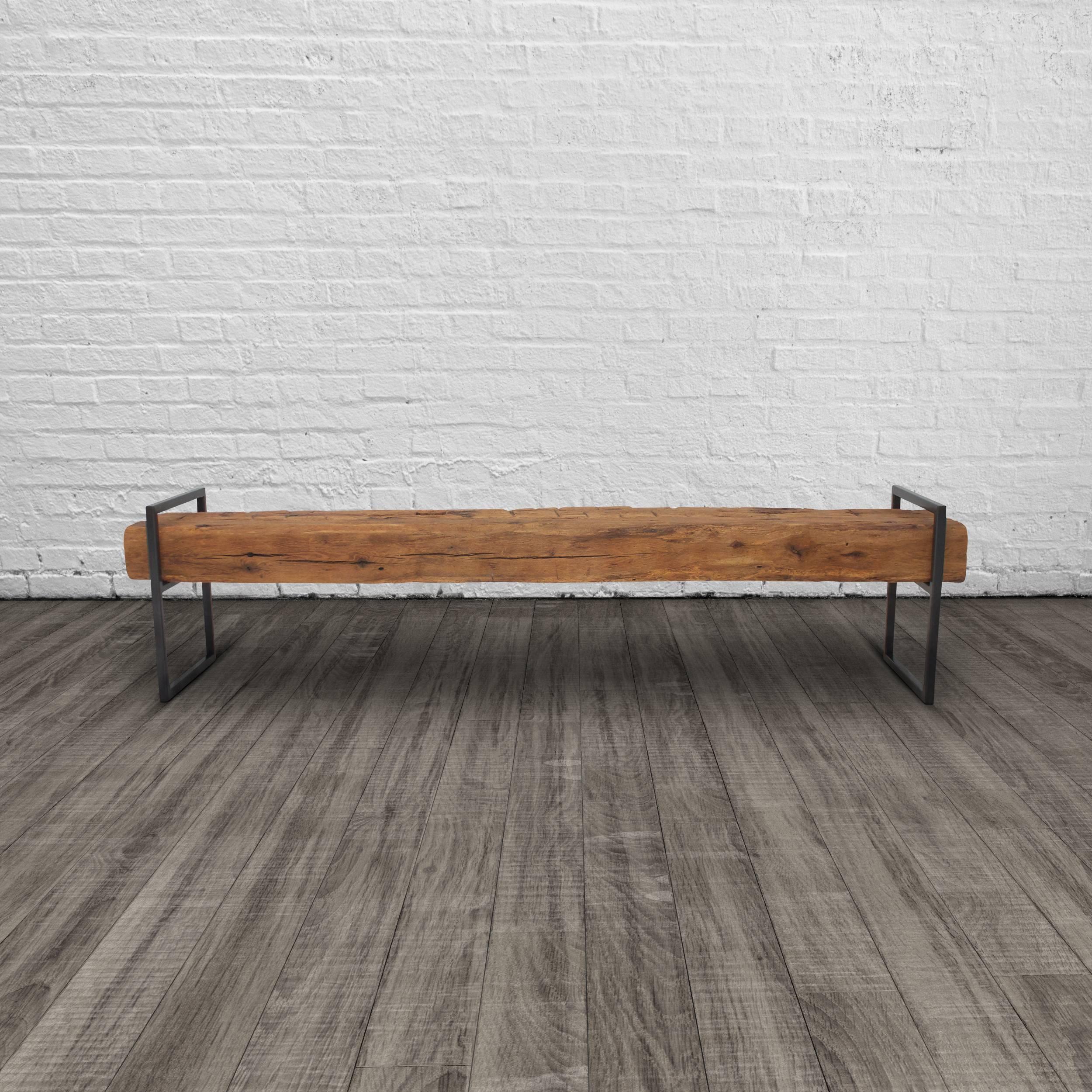 This modern Minimalist bench is constructed from two structural oak beams that appear to float upon a welded steel frame. These historic beams were salvaged from a Bed-Stuy brownstone during demolition, likely dating from the 1860's the character of