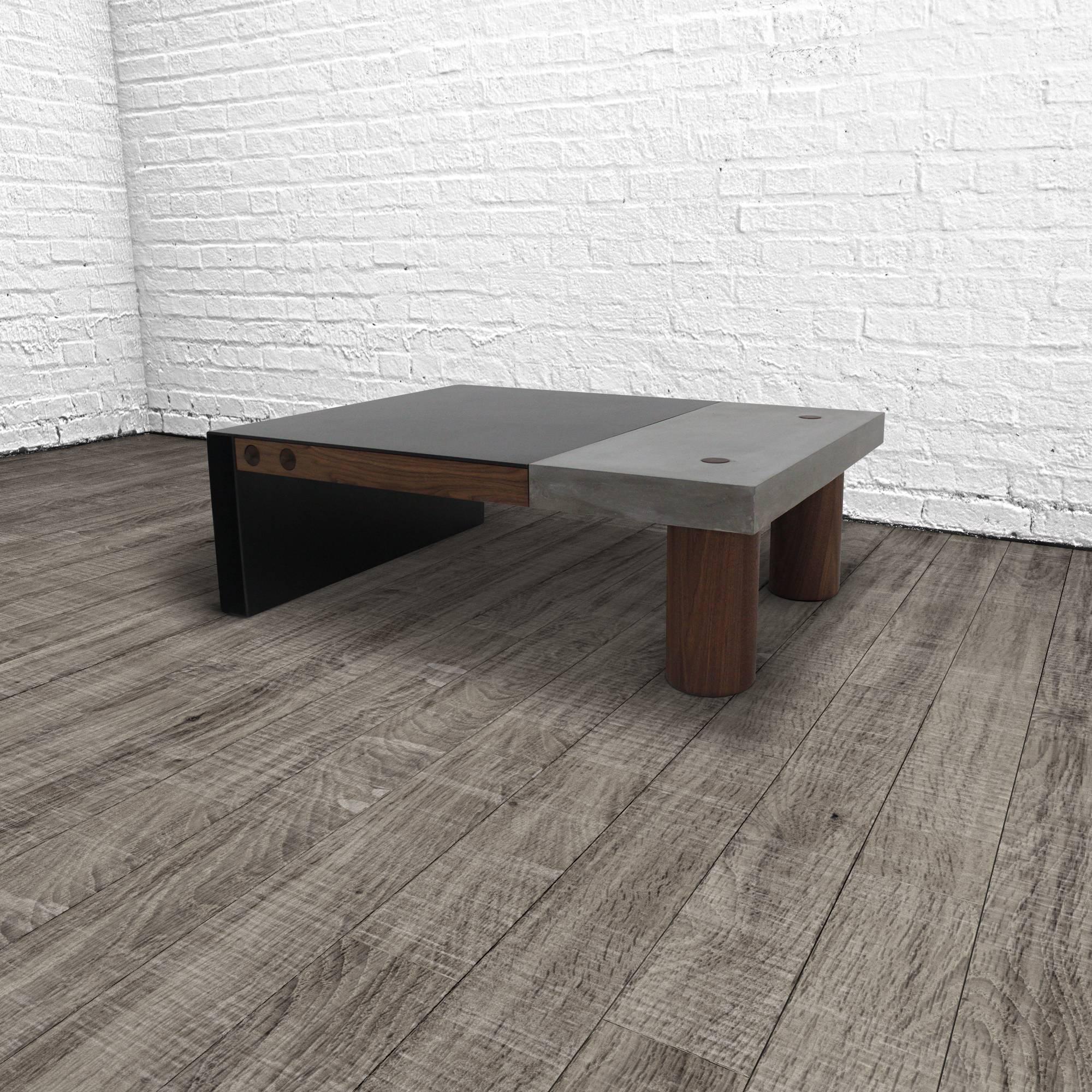 The paradigm coffee table seamlessly integrates three elemental materials, concrete, steel and wood. The combination of cast concrete with hand-turned walnut legs and thru-tenon joinery married to hand-blackened steel with an oil and wax finish