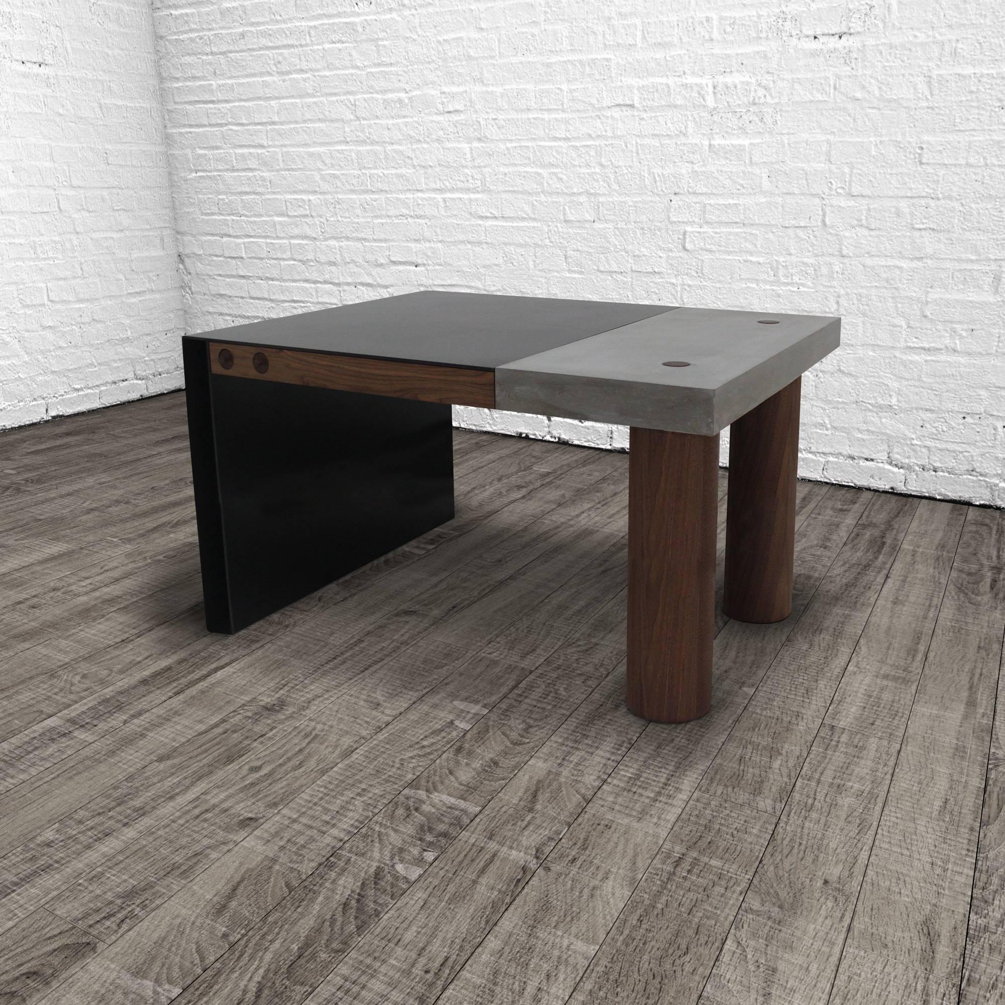 The paradigm desk seamlessly integrates three elemental materials, concrete, steel and wood. The combination of cast concrete with hand-turned walnut legs and thru-tenon joinery married to hand-blackened steel with an oil and wax finish make for a