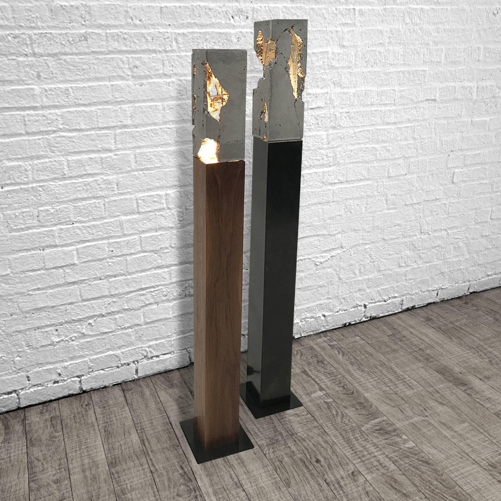 These lights are composed of a solid wood or hand-blackened steel base with a cast-concrete 