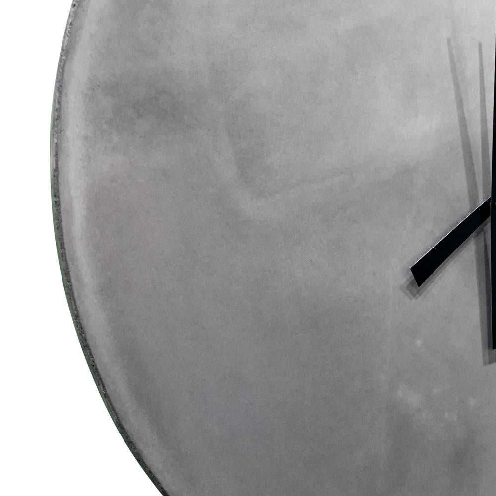 This impressive clock is made from cast-concrete. The high-torque clock motor runs on a single AA battery and adjusts automatically to daylight savings time in the US.

This is a bespoke piece so custom dimensions, materials, colors and finishes