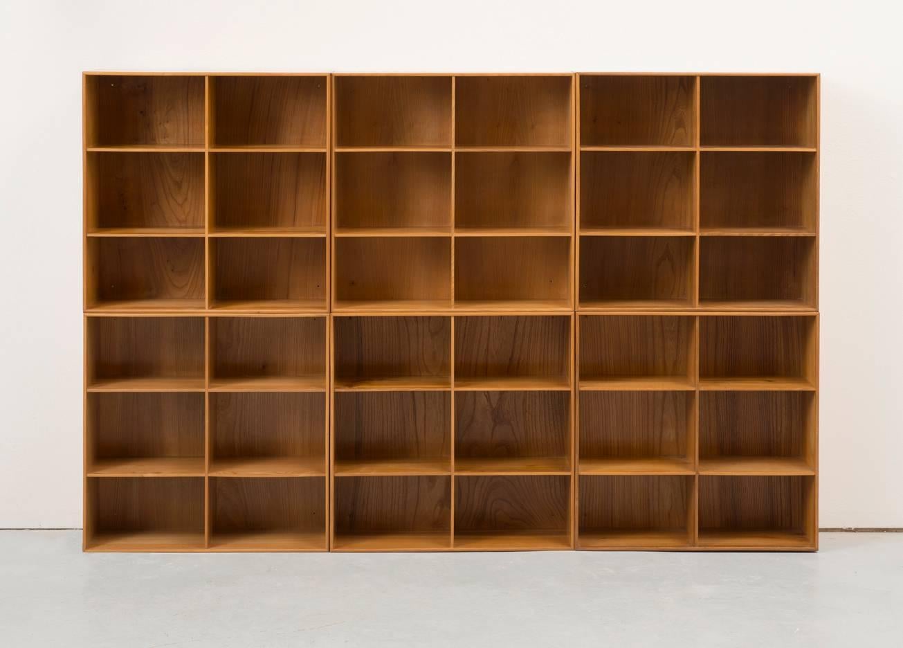 A rare set of six solid elm bookcases with dovetail joinery and brass fittings. This flexible, modular system allows for multiple configurations.
