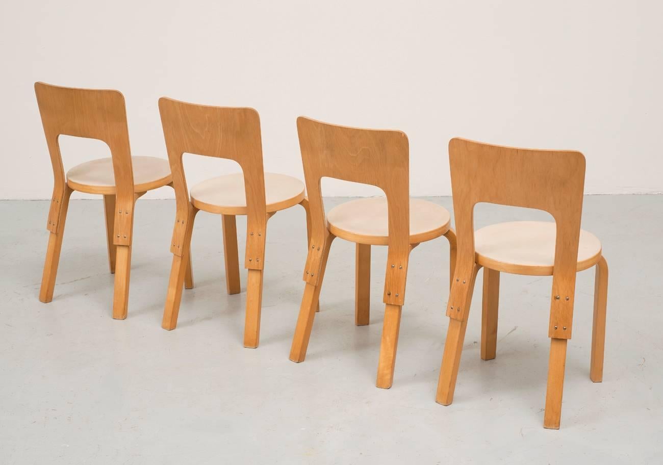 A set of four model 66 chairs by Alvar Aalto designed in 1930s and manufactured by Artek.