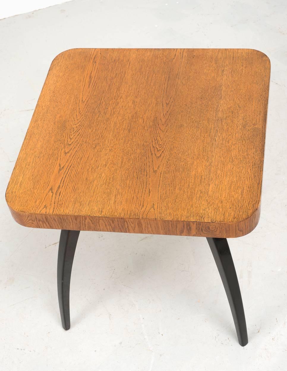 Striking side table model H259 by Jindrich Halabala. Designed in Prague in 1930, manufactured by UP Zavody. Oak ebonized legs and oak varnished top with beautiful wood grain details.
