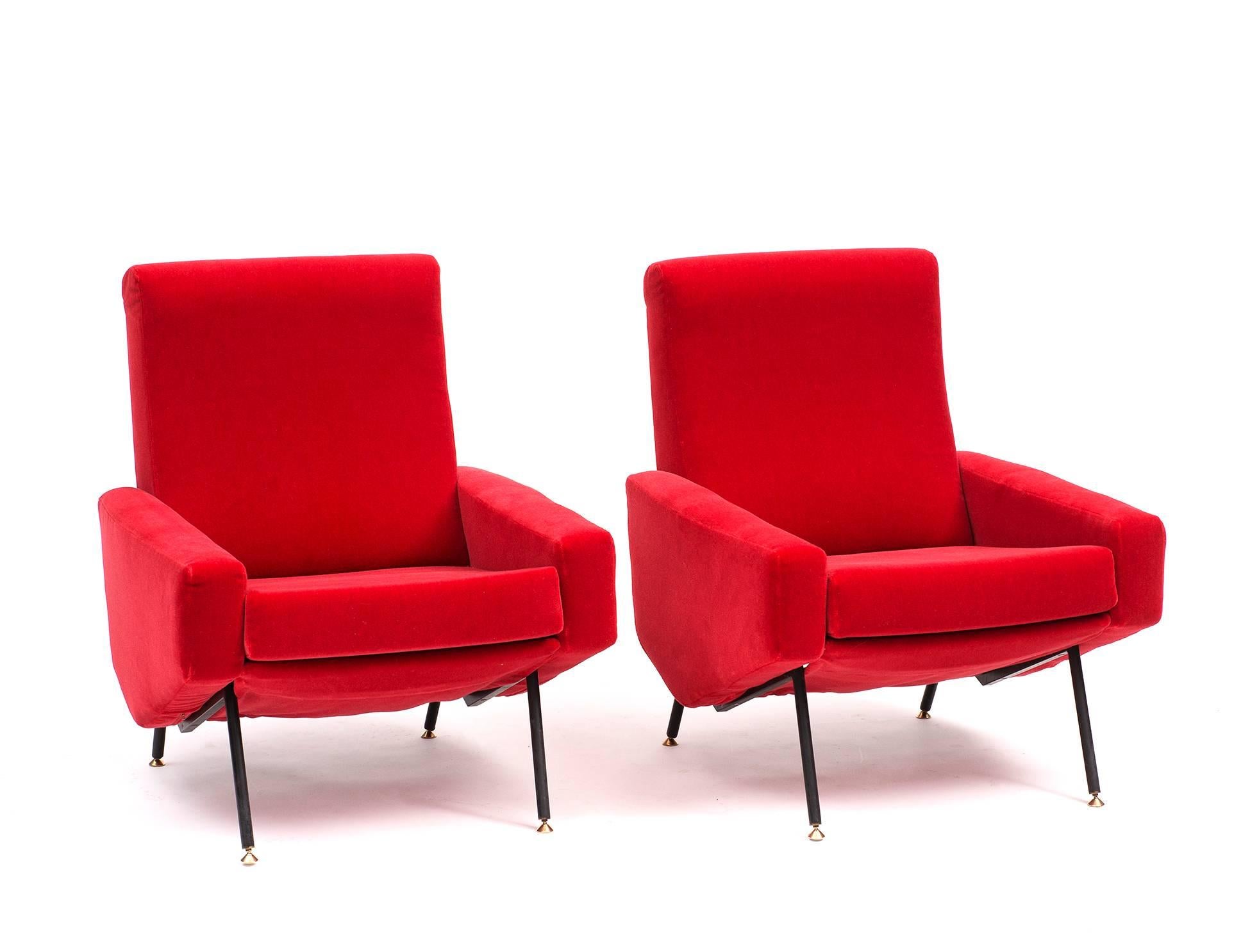 A pair of classic Guariche Troika lounge chairs, newly reupholstered in a red Leo Schellens mohair velvet, France, 1950s.