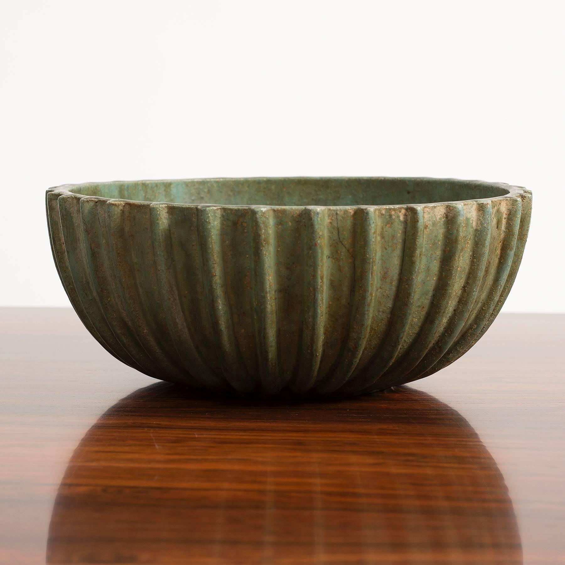 A large ribbed bowl by Arne Bang in green glaze, signed with his 