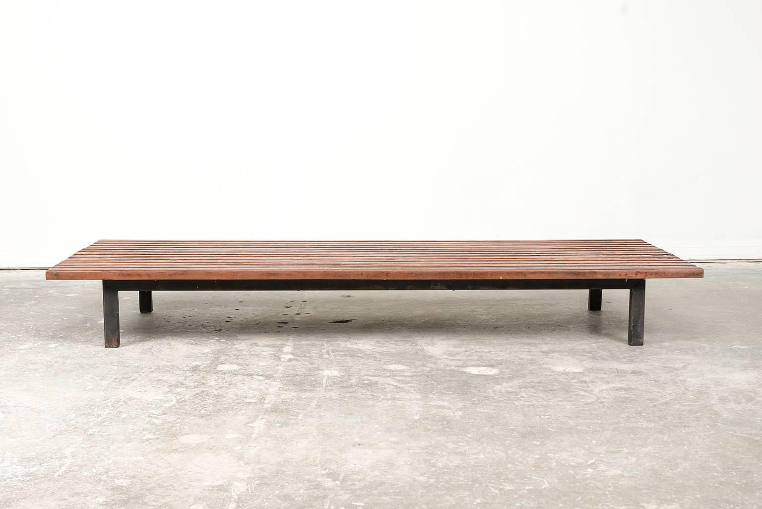 A lovely example of the Cansado Bench in mahogany by Charlotte Perriand. Manufactured by Steph Simon, France, circa 1950.