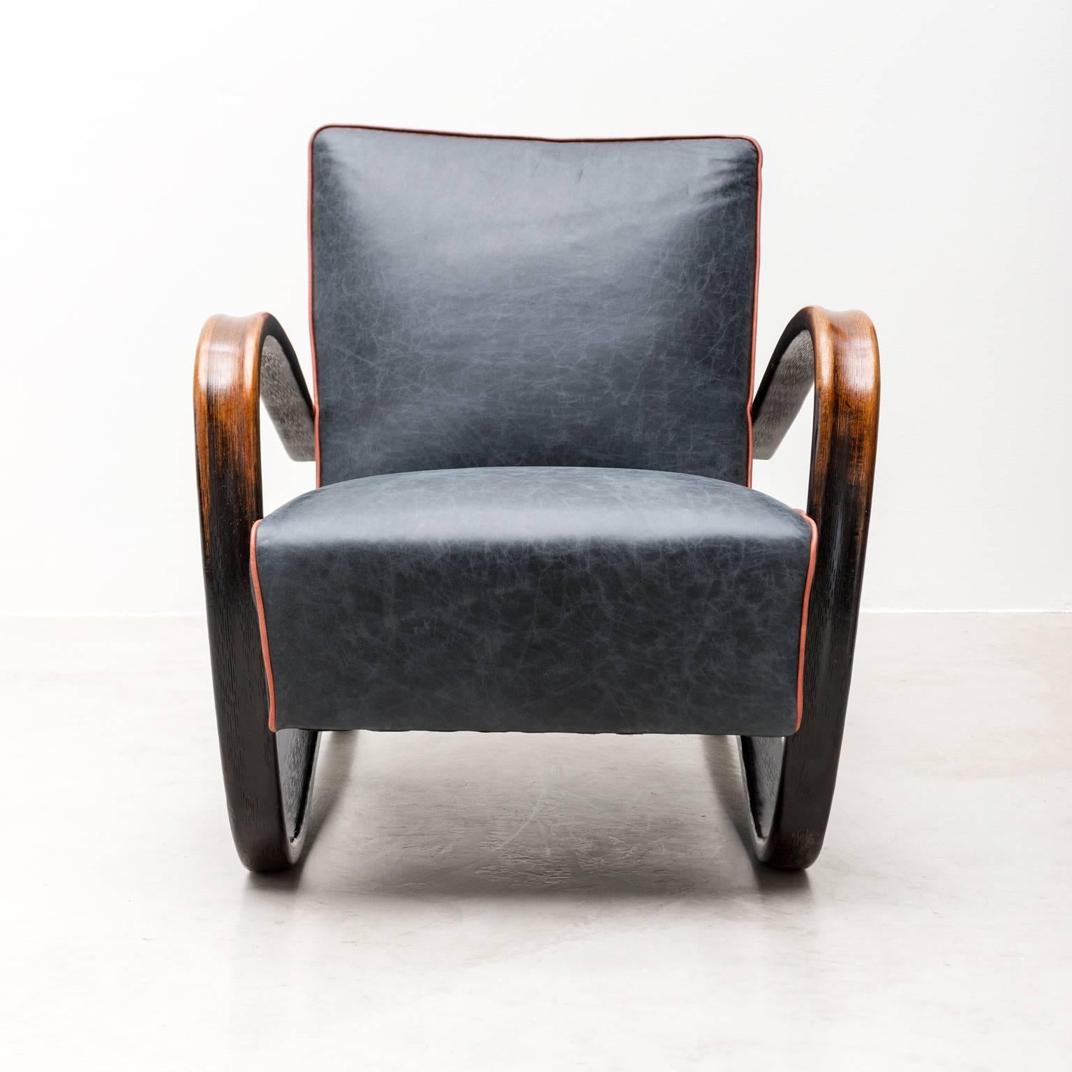 A stunning pair of model H269 chairs by Jindrich Halabala. These chairs retain their original patina on the beech ebonized arms, which has been enhanced by a French polish technique. They have been stripped to their seagrass and springs and