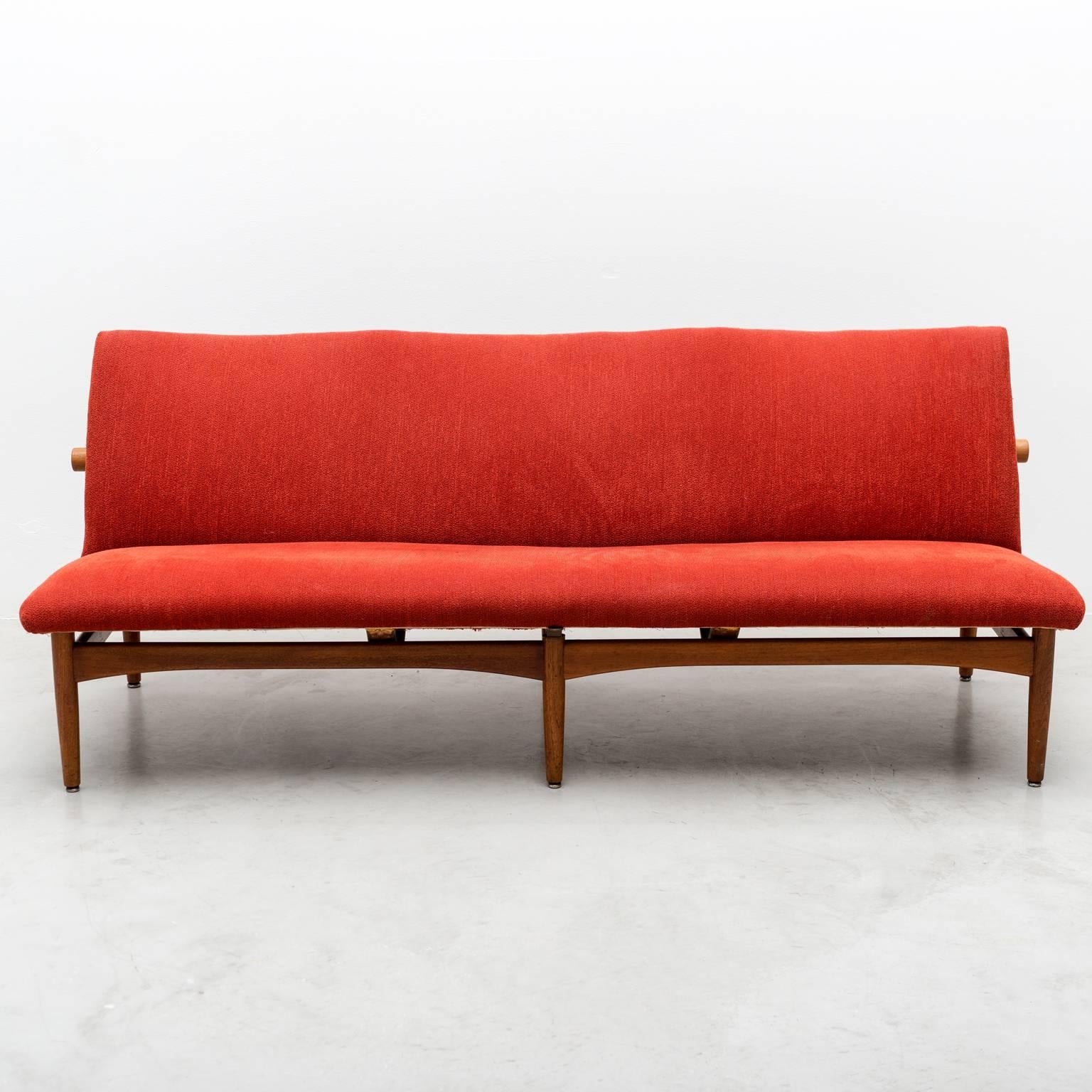 A rare sofa by Finn Juhl, Model 137, in teak for France and Daverkosen. Recently reupholstered in place textiles tomato red wool, Denmark, 1950s.