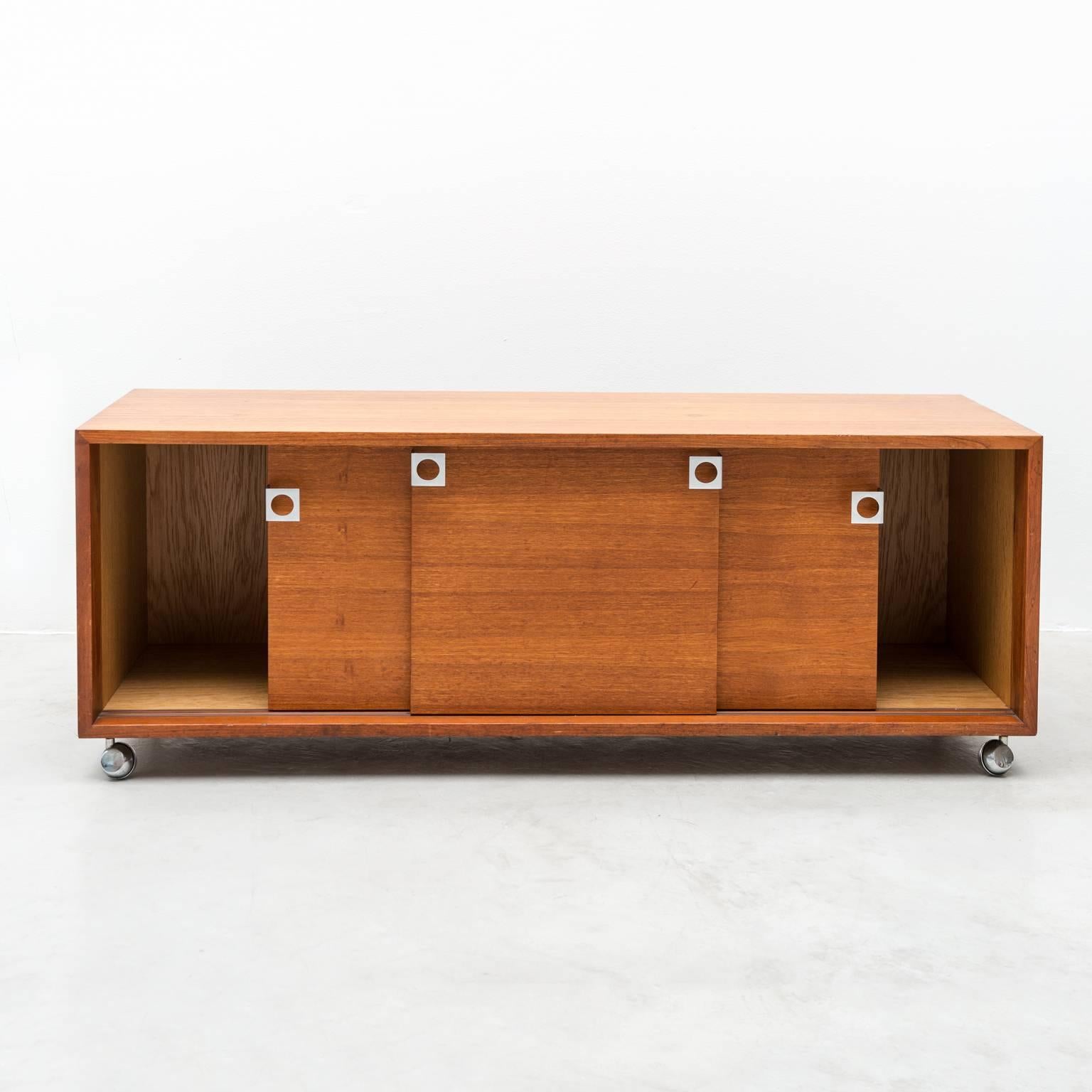 Handsome small credenza in teak with stainless steel pulls and castors by Bodil Kjaer for E. Pedersen & Son. In fine original condition, Denmark, 1960s.