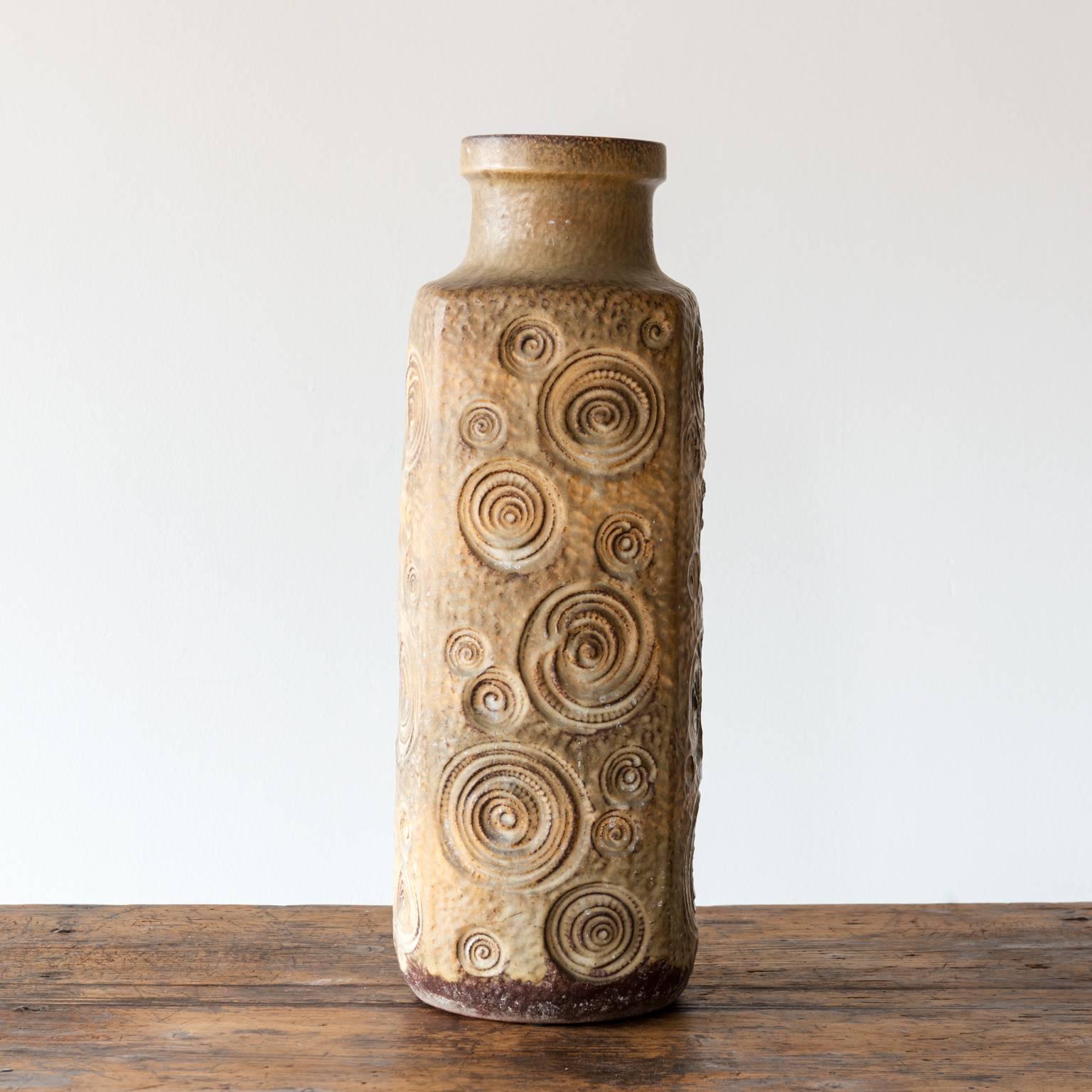 A striking, tall, modernist, ceramic vase from France in a warm glaze with a spiral pattern, France, mid-20th century.