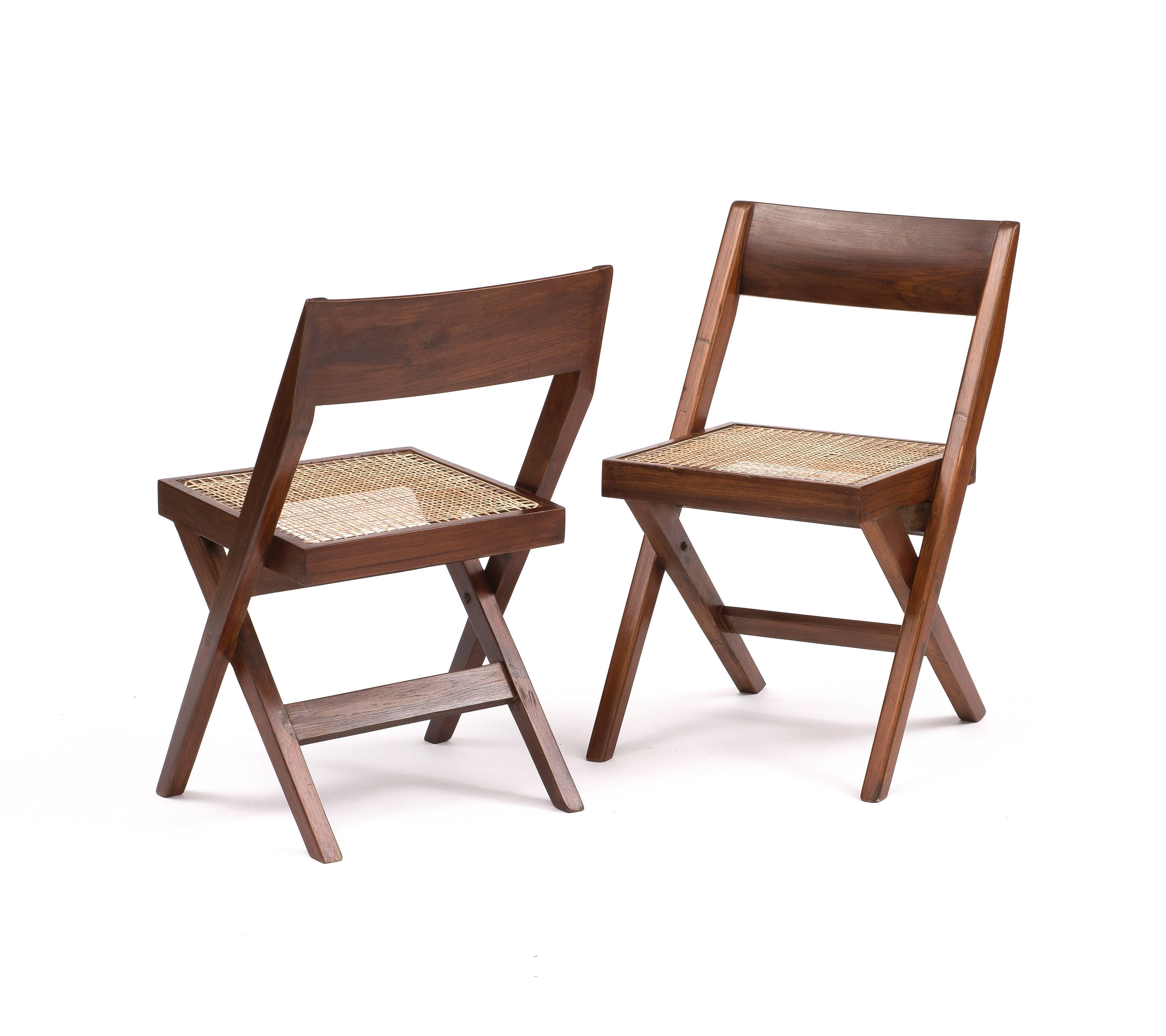 A set of six library chairs in teak and cane by Pierre Jeanneret for Chandigarh, 1950. Cushions included.