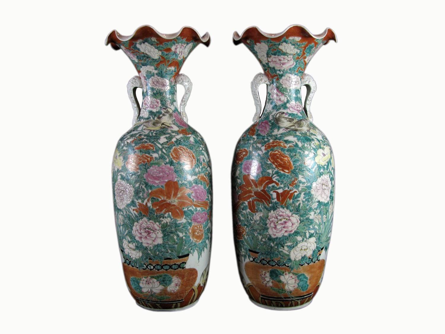 A pair of large antique Kutani style Japanese vases dating back to late 19th century in very good condition.
They are fully hand-painted with vases of polychrome flowers and peony heads and foliage, richly decorated with vegetal elements and