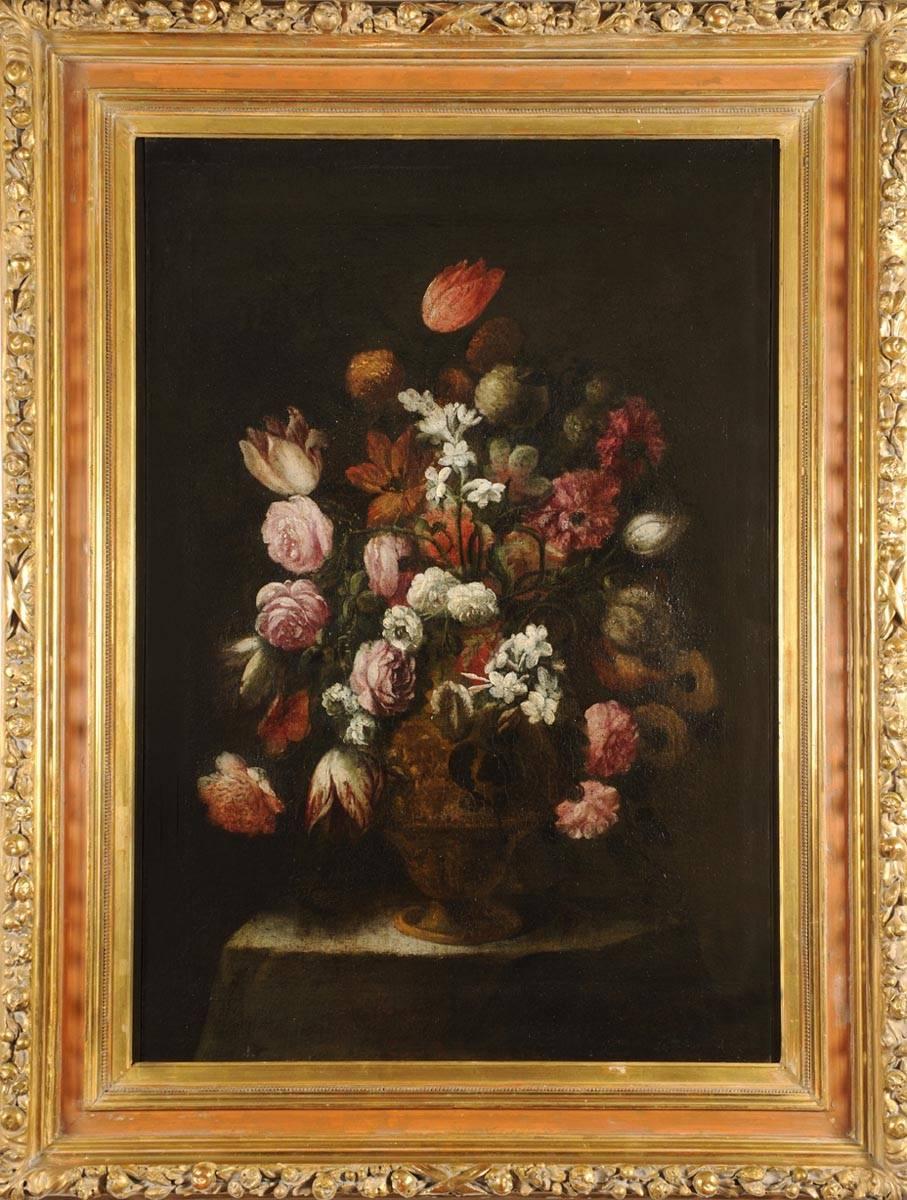 Italian oil on canvas painting depicting a Still Life of roses tulips, peonies and jasmine flowers in a pottery vase, of Lombard Area,  North Italy, dating back to the second half of 17th century. 
The work comes from a private residence in Milan,