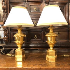 Paire de lampes Empire italiennes en bois sculpté et doré du XIXe siècle
