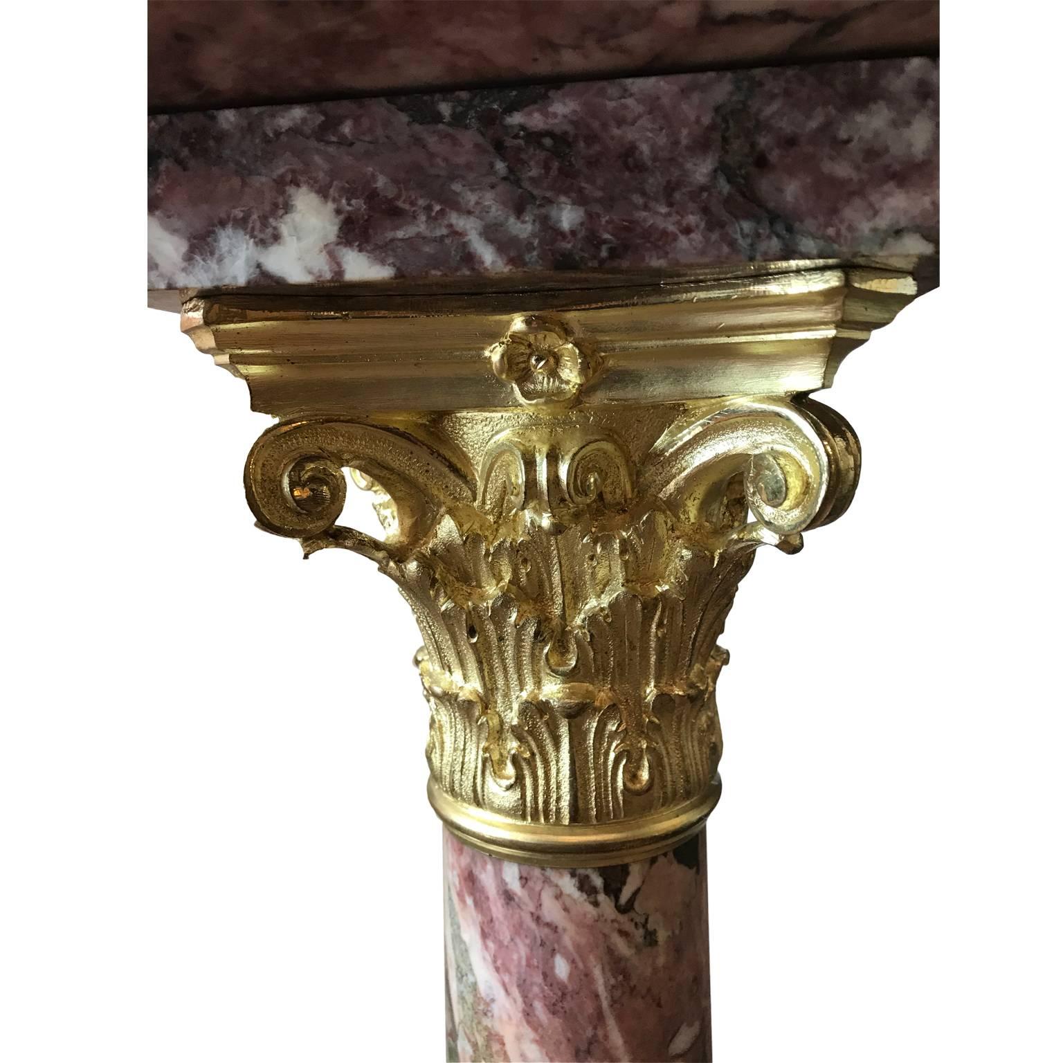 19th century Italian Breche violet marble and ormolu-mounted pedestal, a square column made of Fior Di Pesco, an elegant kind of grey marble incorporating pink, lilac and violet shades alongside the white veining. It comes from the furnishings of a