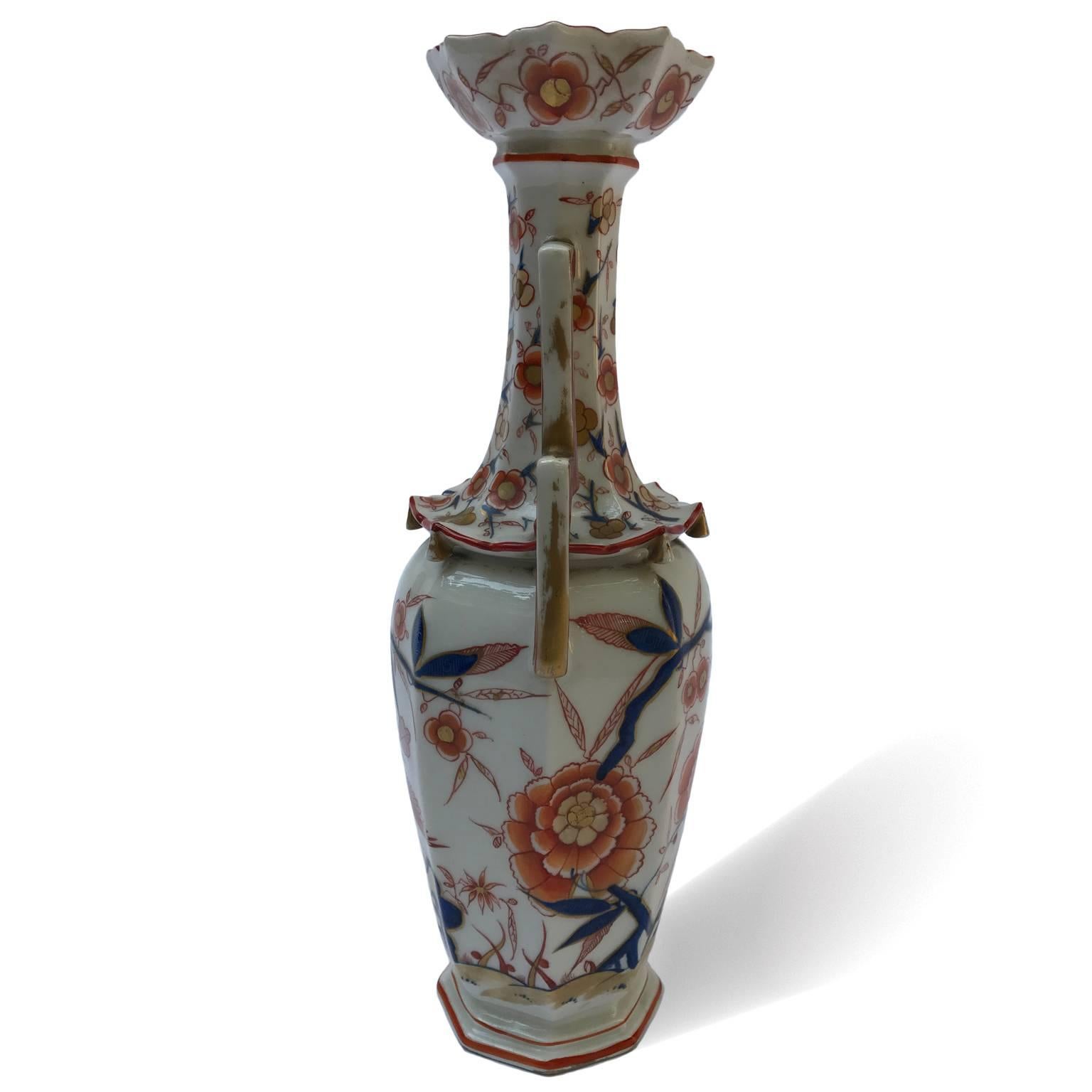 Pair of French Samson porcelain baluster vases, circa 1870. Two octagonal vases softly decorated by floral pattern, red peach flowers and small flowers in red, blue colors and gold on white ground. 
The main body is decorated throughout with