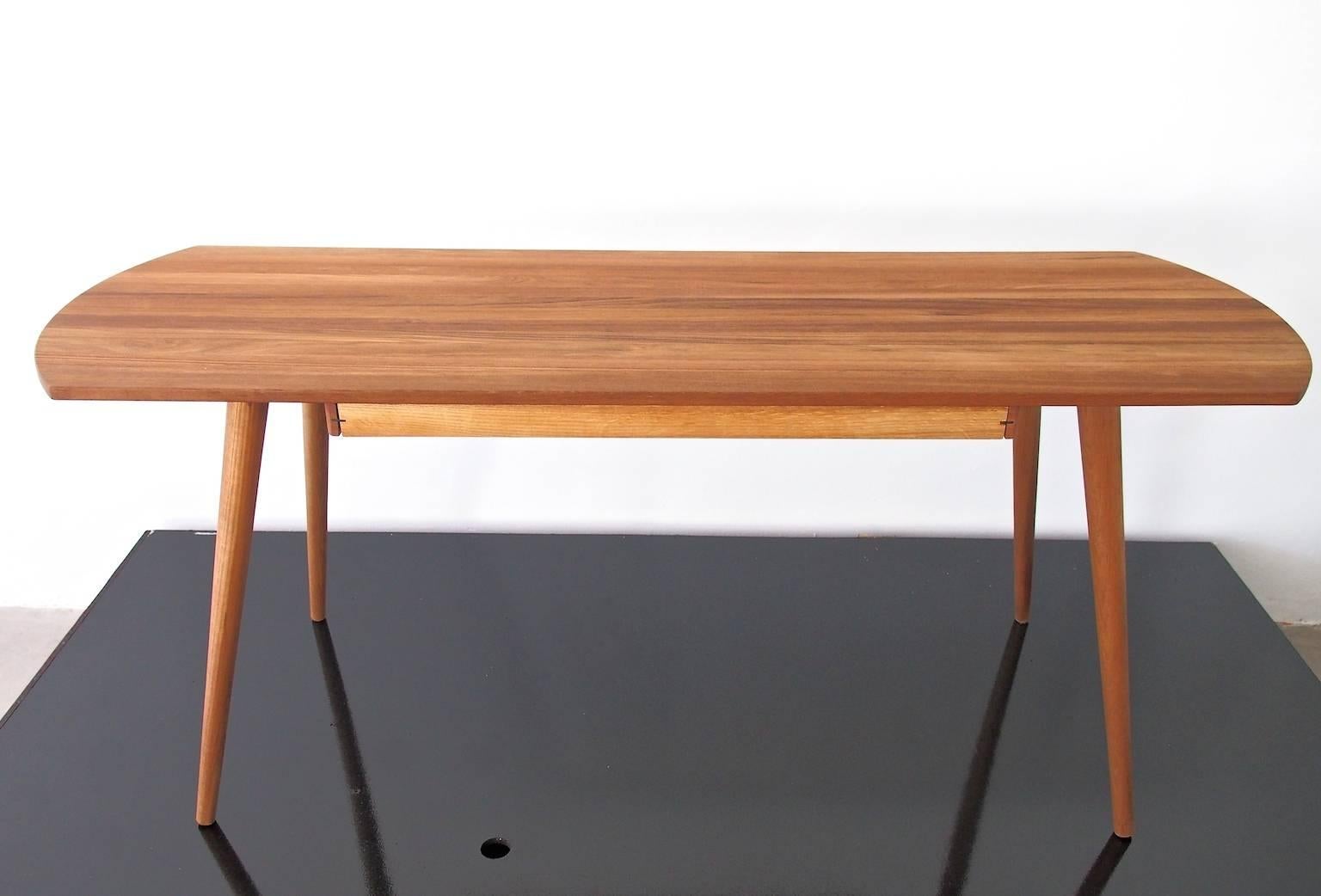 Sleek writing desk with solid teak top and a drawer with ball lock. Danish design, model S-Board, produced by B.G. Design, circa 1960s.