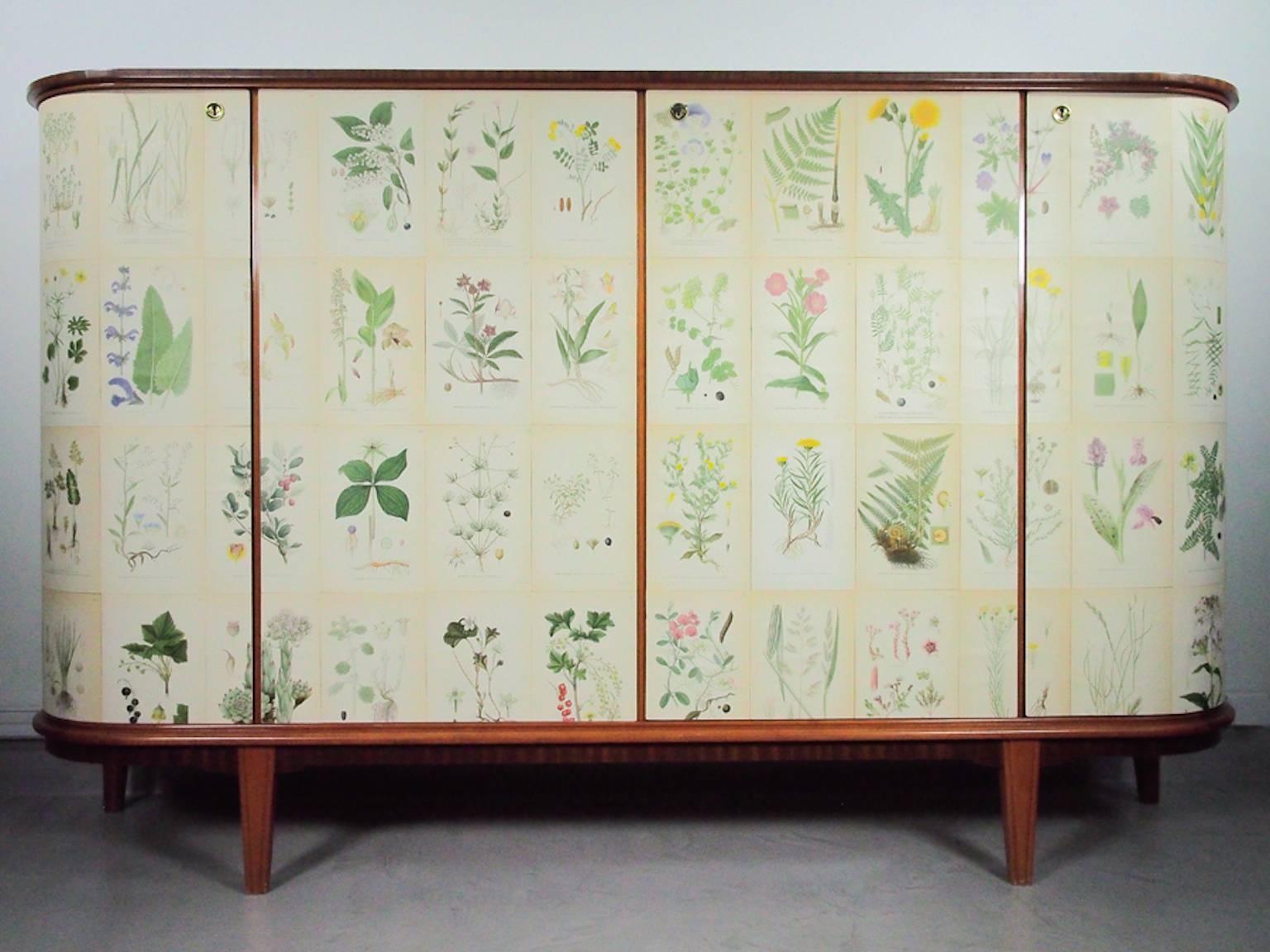 Beautiful wooden cabinet decorated with illustrations from the book 