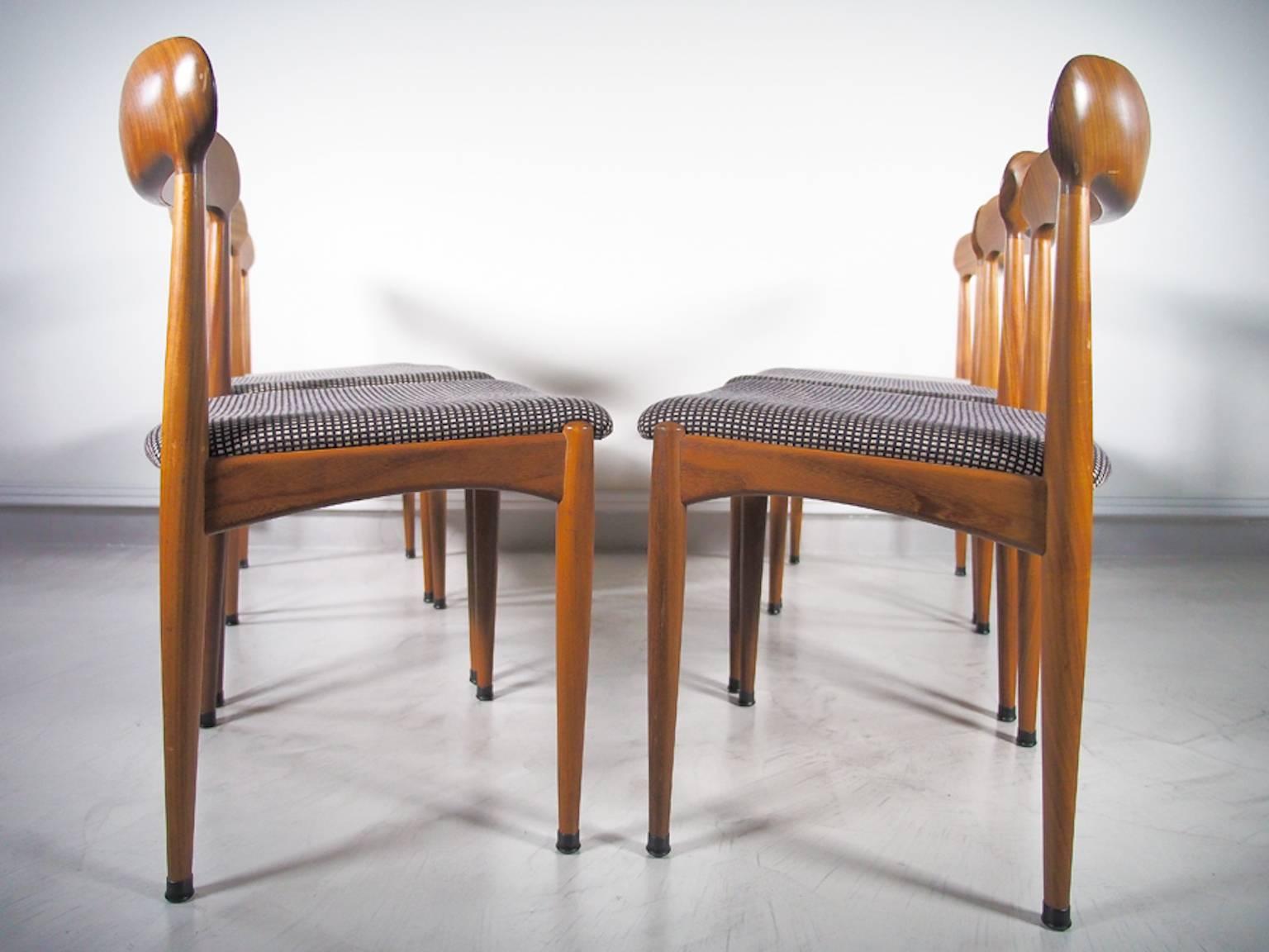 Set of six teak chairs with chequered wool upholstery from the 1960s by Danish furniture designer Johannes Andersen. The seats have a beautiful organically shaped backrest. Produced by Uldum Mobelfabrik in Denmark.