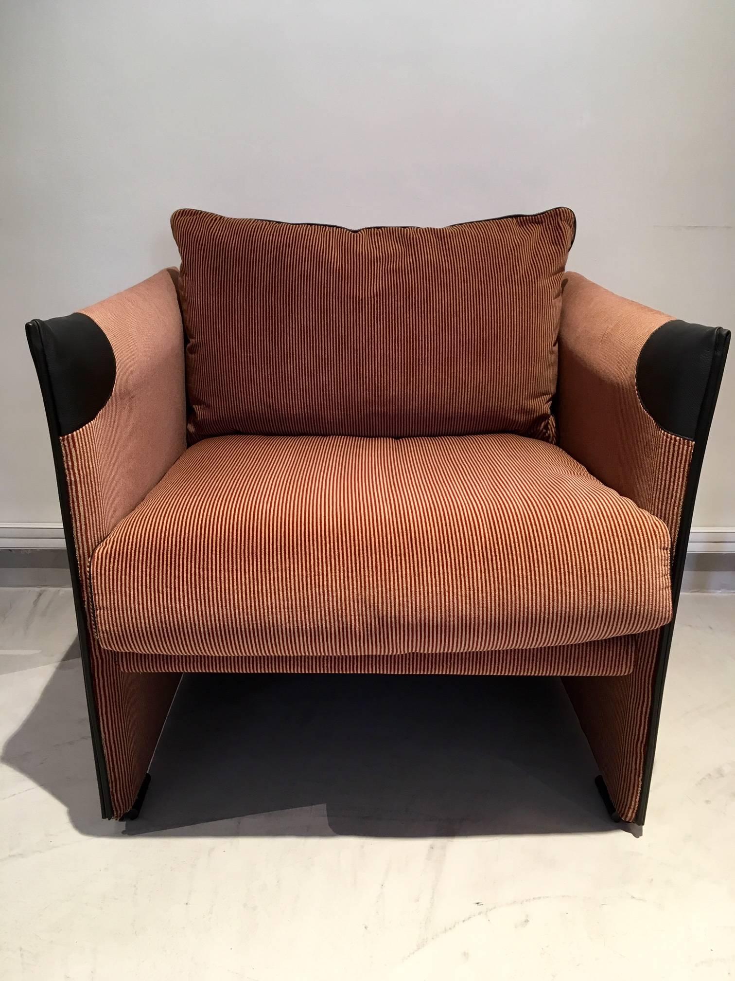 Very comfortable lounge chair by renowned Italian designer Mario Bellini for Cassina. Upholstered in striped velvet fabric with black leather and zipper details. Loose seat cushion filled with down feathers. Marked 