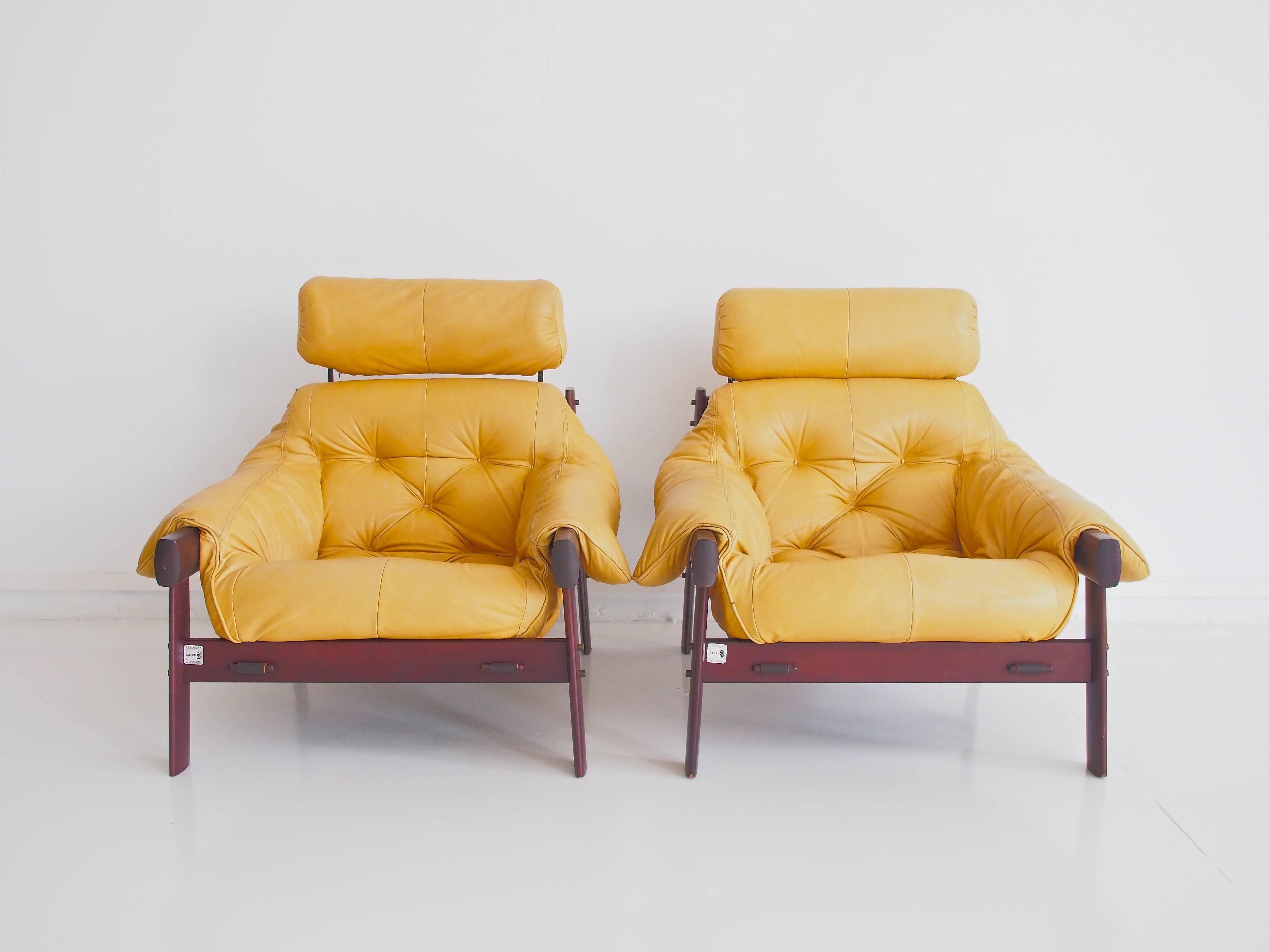 Pair of fantastic armchairs and a footstool designed by Percival Lafer, model MP-041. Frame made of Brazilian mahogany, upholstered in light brown/yellow leather. Manufactured by Lafer co. Furniture in Brazil in the 1960s.