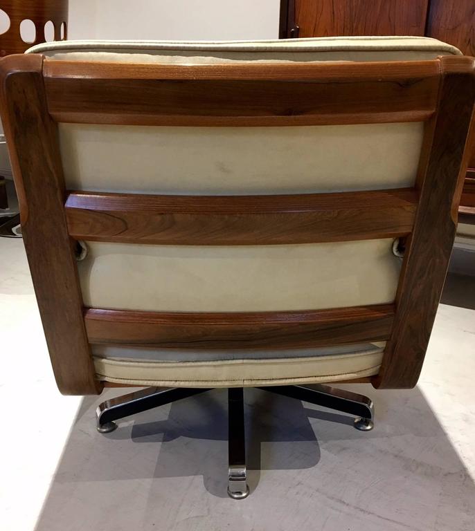 Pair of CreamColored Leather Swivel Armchairs with Wooden Frame at