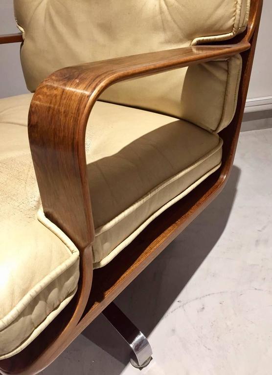 Pair of CreamColored Leather Swivel Armchairs with Wooden Frame at