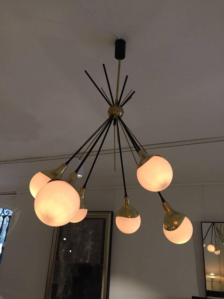 Original Stilnovo lamp with six-light arms. Construction of brass, lacquered metal suspension and opal glass. Manufactured in Italy by Stilnovo during the 1950s. The electric wiring has gone through a full restoration process.
