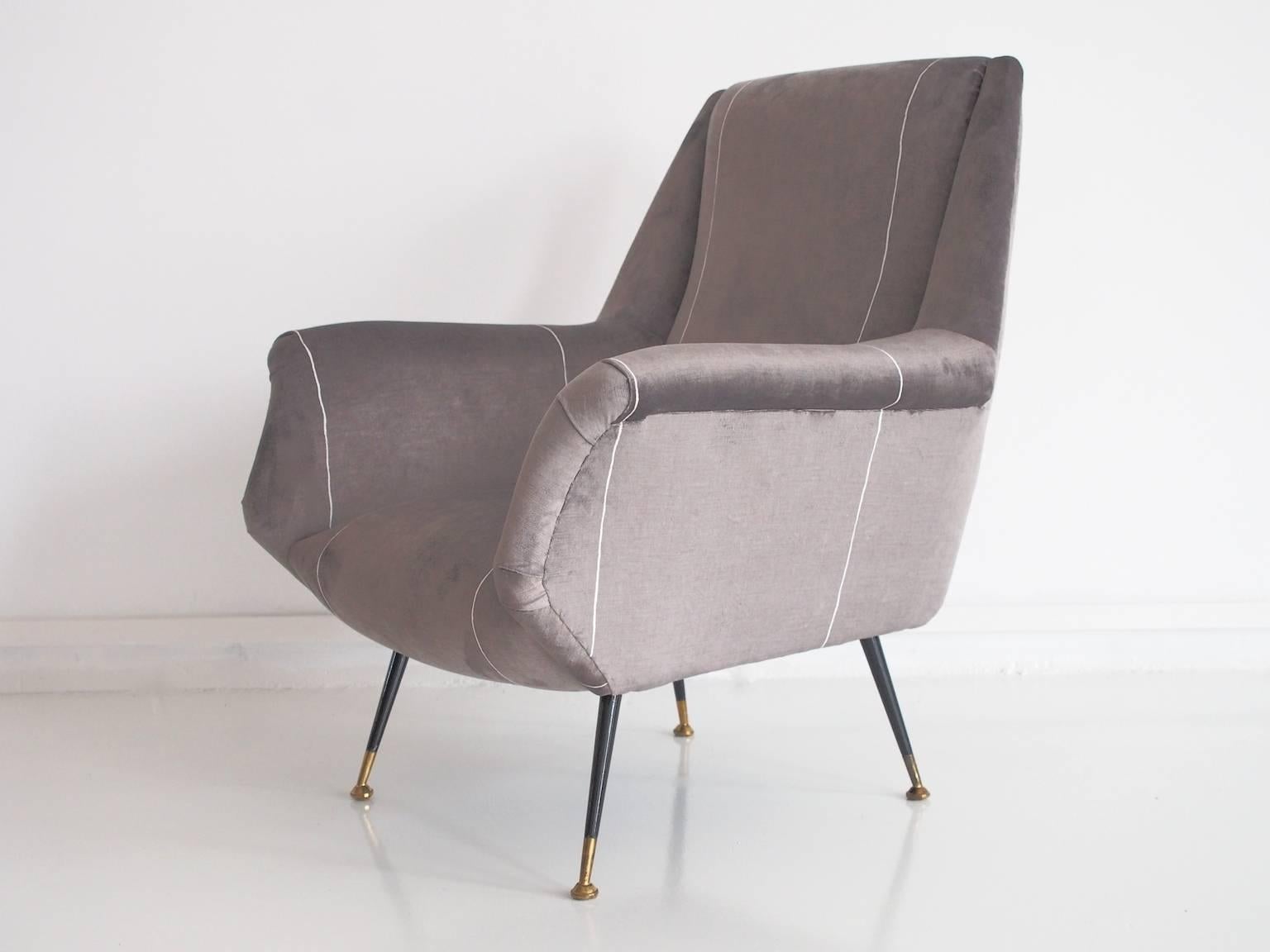 Newly upholstered Italian armchair in lightly striped grey velvet fabric with lacquered brass feet from circa 1950s.
Sofa in set also available, sold separately.