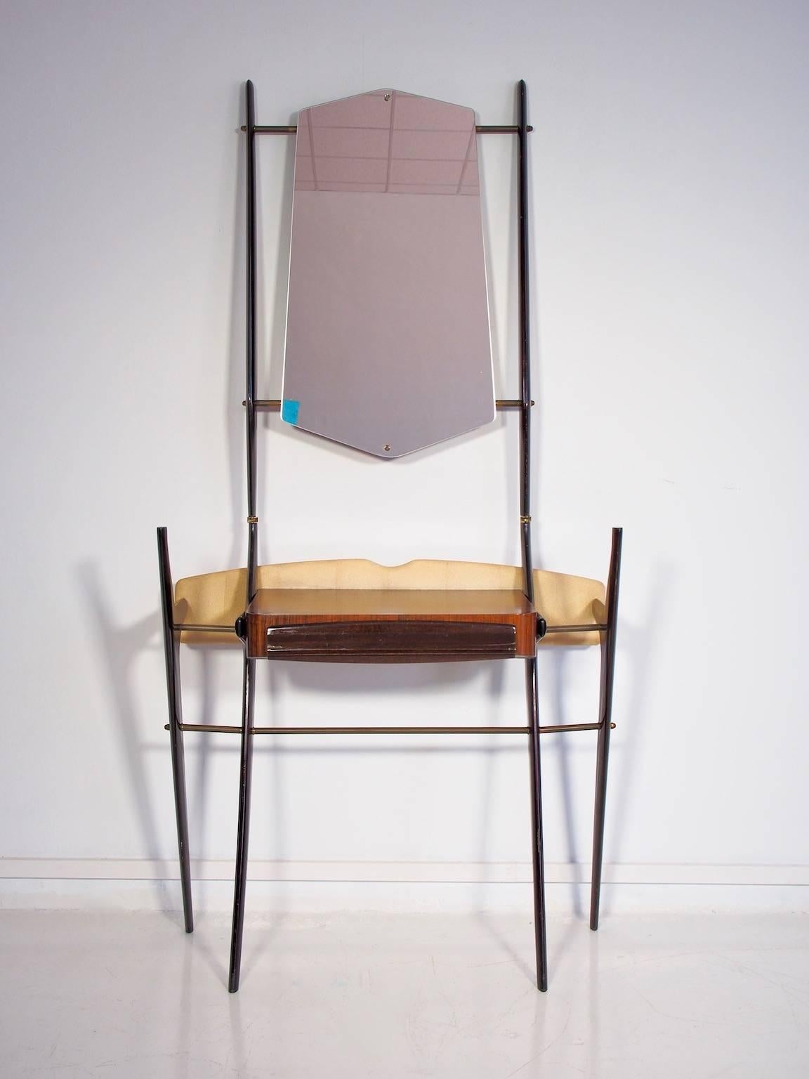Incredible scissor shaped console with glass shelf and wooden drawer compartment. Lacquered rosewood with brass clips. Back platform upholstered in faux fabric with board screws to attach the piece to the wall if desired.
