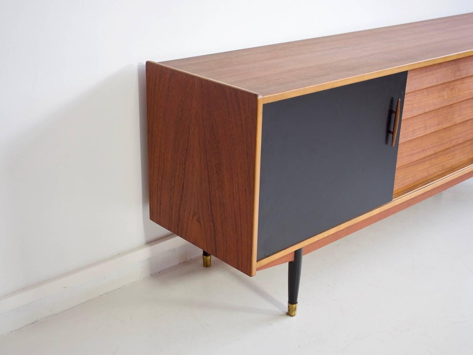 Brass Long Teak Sideboard with Drawers and Black Sliding Doors by Hugo Troeds