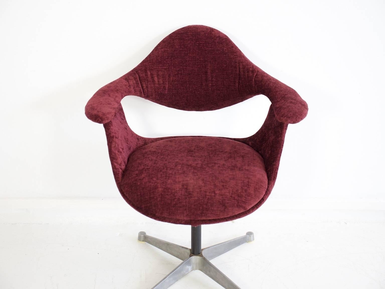 George Nelson DAF swivel chair produced by ICF De Padova, upholstered in burgundy red velvet fabric and with Industrial metal base. Very comfortable chair. Labeled on its base for both designer and maker. Very rare.