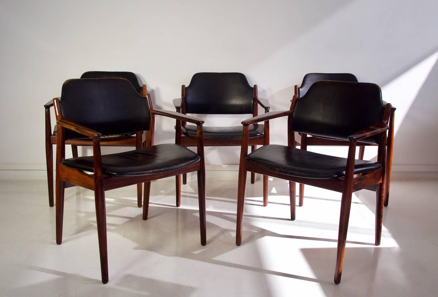 Arne Vodder armchairs with solid rosewood frame and black leather upholstery. Designed in 1961 and produced by Sibast Mobler, model 62A. Renewed rosewood frame. Leather in great vintage condition with some cracks as seen on photos.