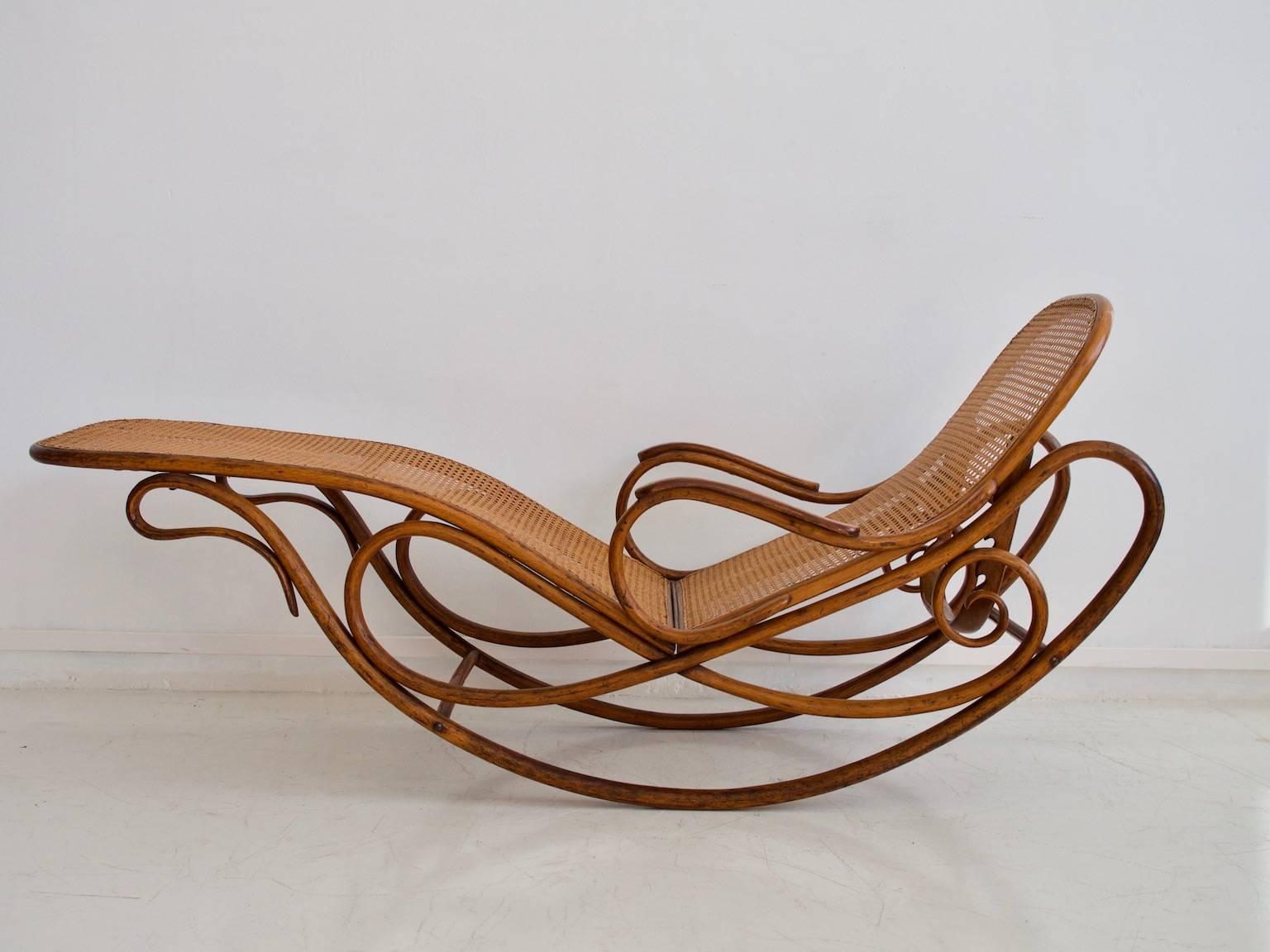 Bent beechwood lounger model 7500 with adjustable backrest and high braided back and seat. Designed in 1881 and manufactured by Thonet in Vienna, Austria.

Literature: Bent Wood and Metal Furniture: 1850-1946: page 232.