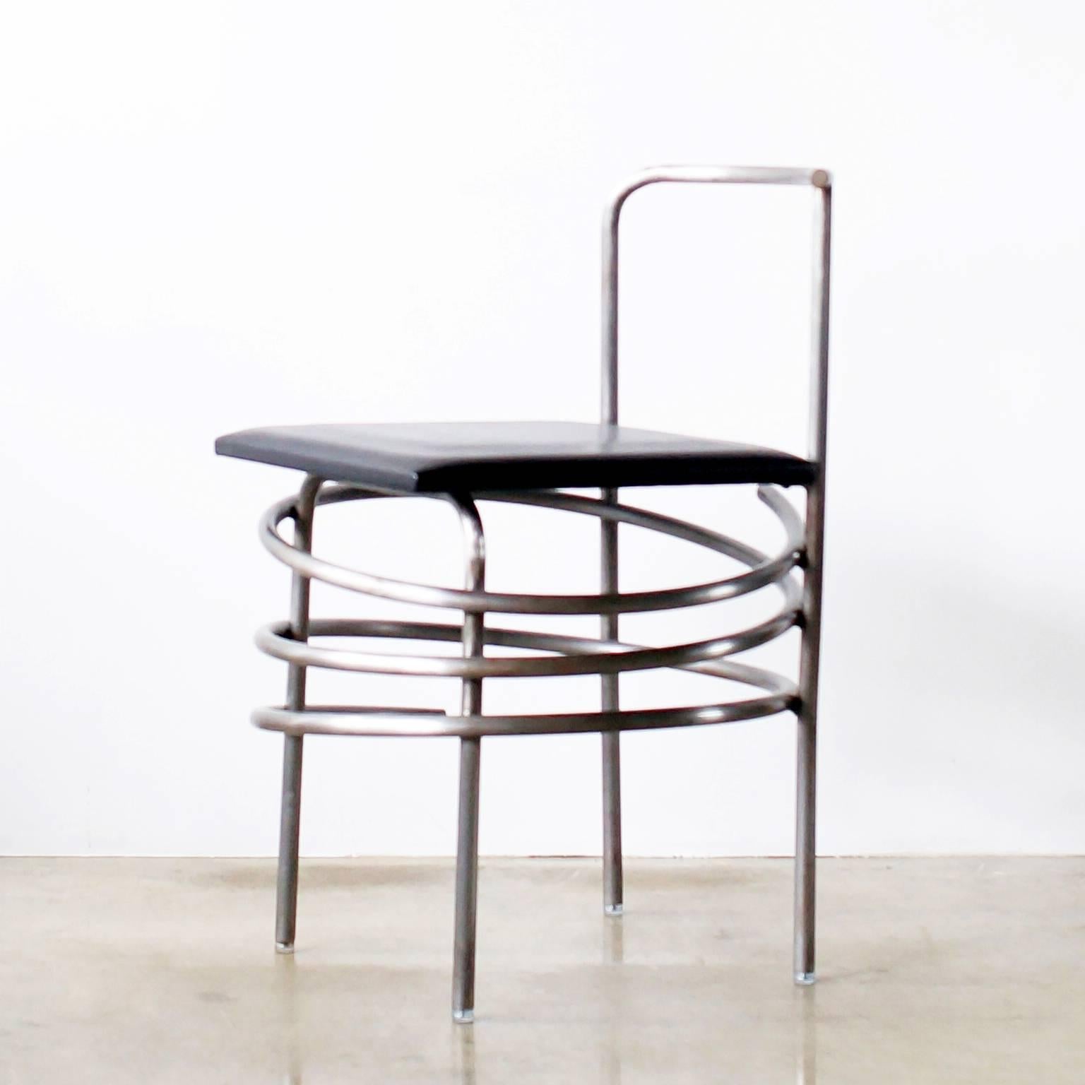 Comme des garçons No.23 chair designed by Rei Kawakubo in the late 1980s.
This chair called spiral chair. Made of very unique rounded steel tube and leather seat.
