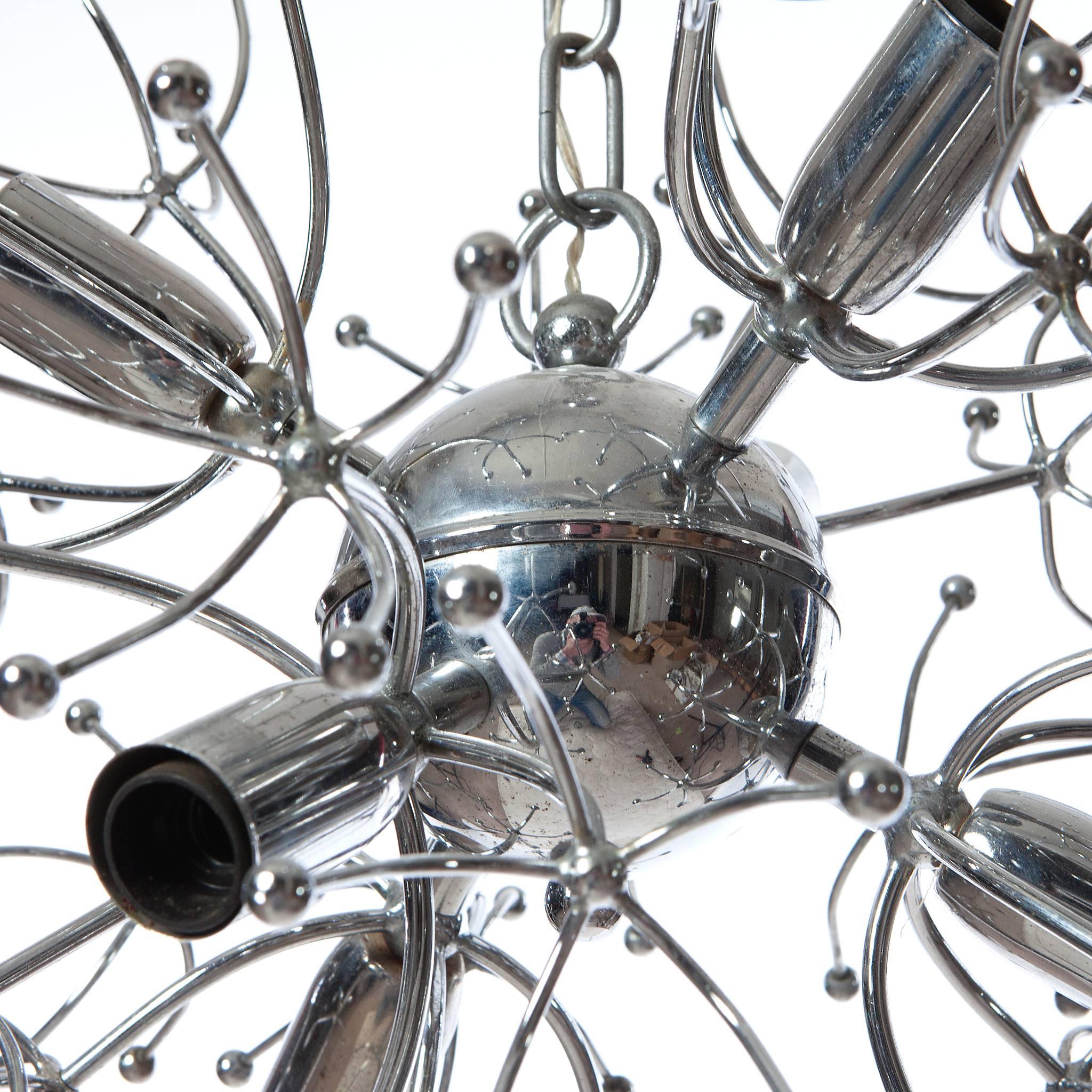 Sensational 1960's Sputnik chandelier by Gaetano Sciolari. The light starts with chrome bal with attached six stems containing a light bulb. Each stem has 5 smaller stems and again another 5 stems holding a little chrome ball at each end.
Please