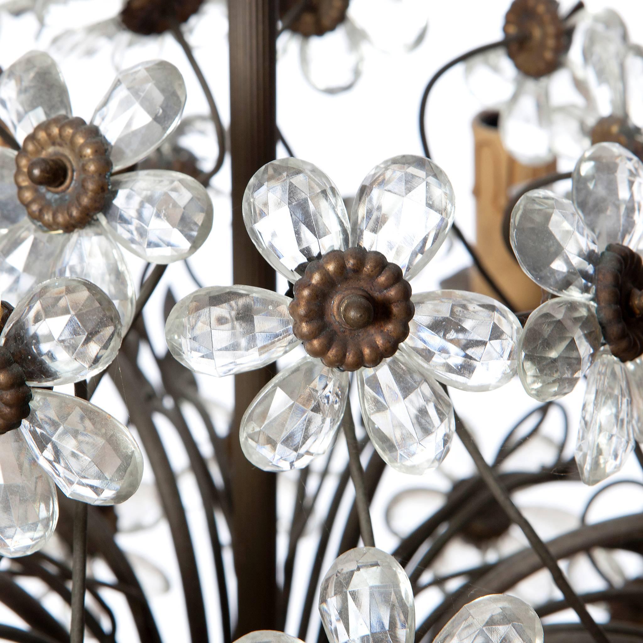 French 1920s chandelier in the shape of a bouquet with crystal flowers and bronze stem by Maison Baguès. Holds six candelabra light bulbs. In good vintage condition.