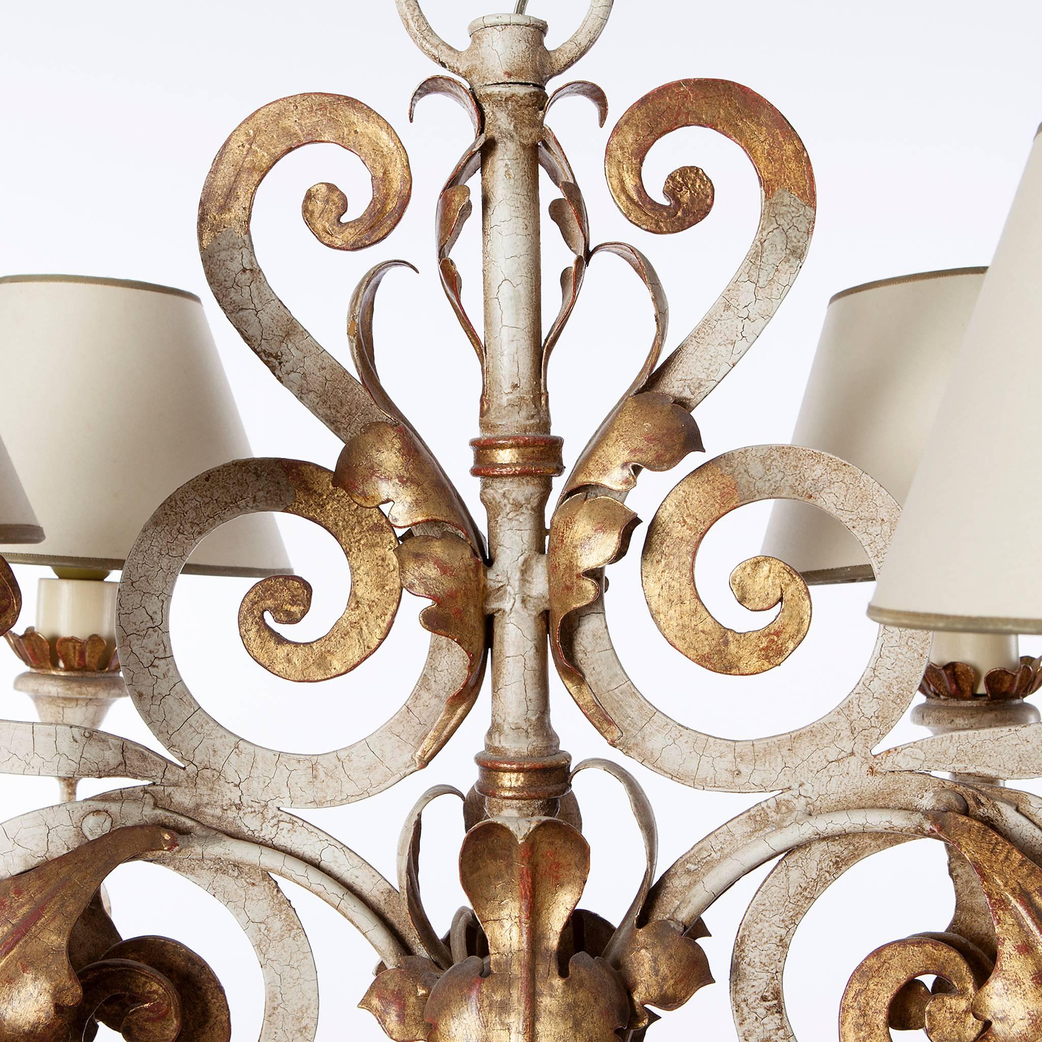 This rare chandelier by Caldwell from circa 1900s is in excellent condition. A four-light polychrome gold-plated wrought iron chandelier suits every room.